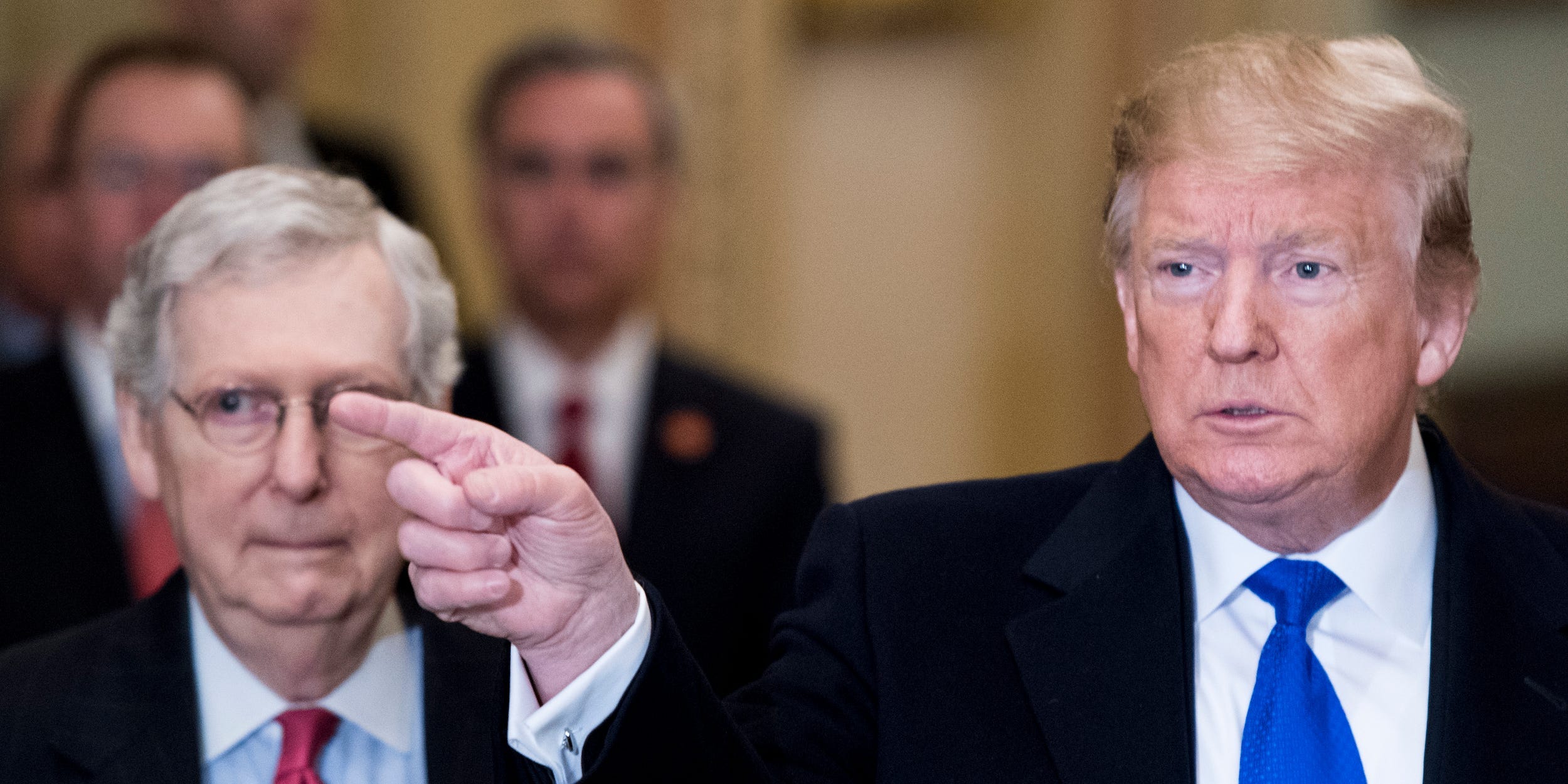 President Donald Trump takes questions from reporters he arrives with Senate Majority Leader Mitch McConnell, R-Ky., for the Senate Republicans' lunch in the Capitol on Tuesday, March 26, 2019.