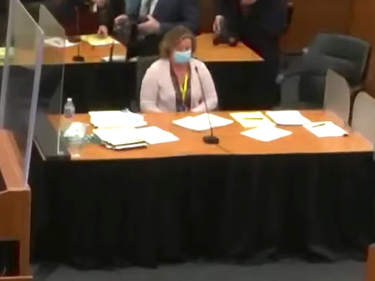 In this screen grab from video, former Brooklyn Center police Officer Kim Potter sits at the defense table, center, as Hennepin County Judge Regina Chu presides over jury selection Tuesday, Nov. 30, 2021, in the trial of Potter in the April 11, 2021, death of Daunte Wright, at the Hennepin County Courthouse in Minneapolis, Minn.