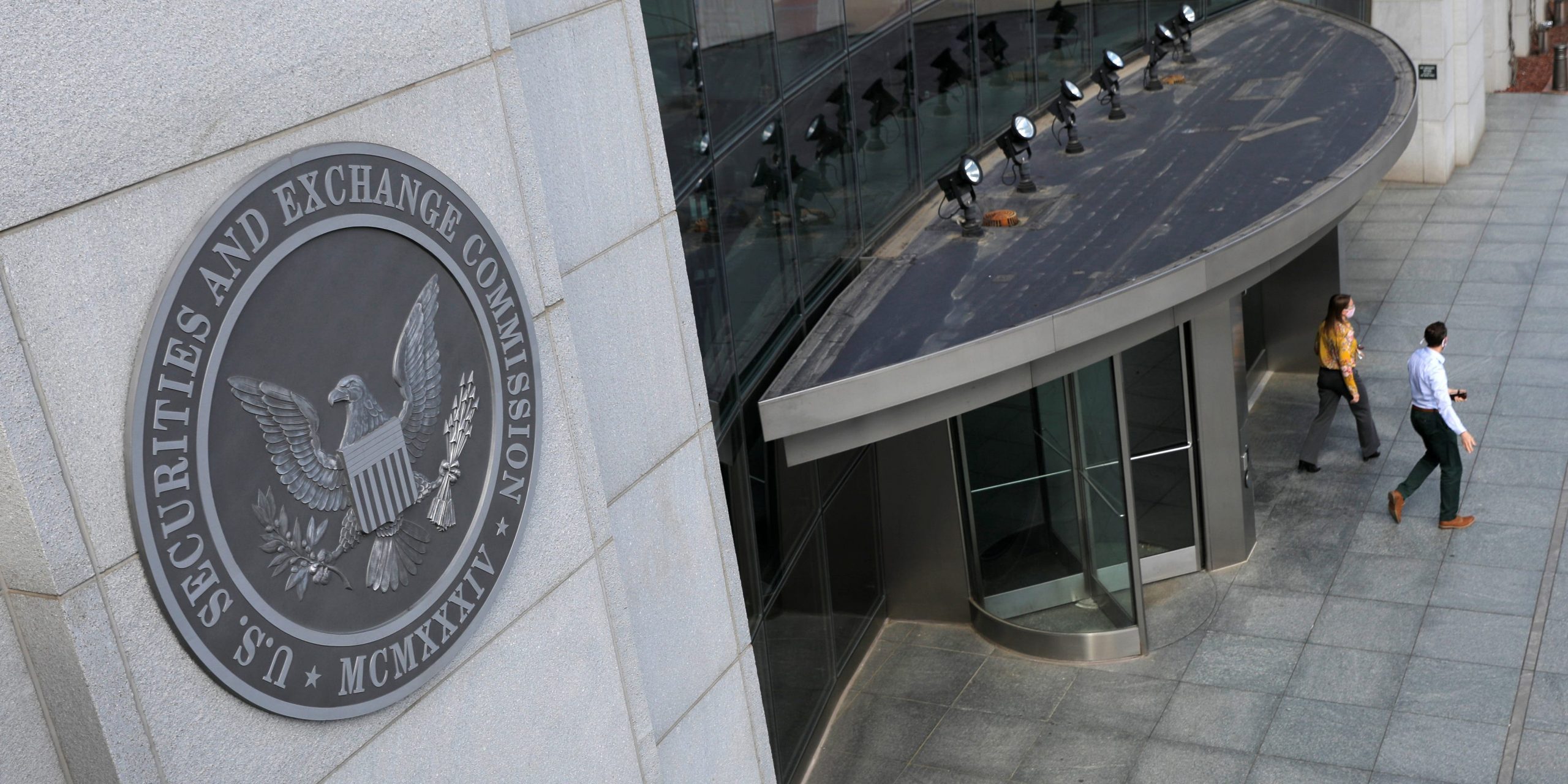 People walking out of the SEC building US Securities and Exchange Commission