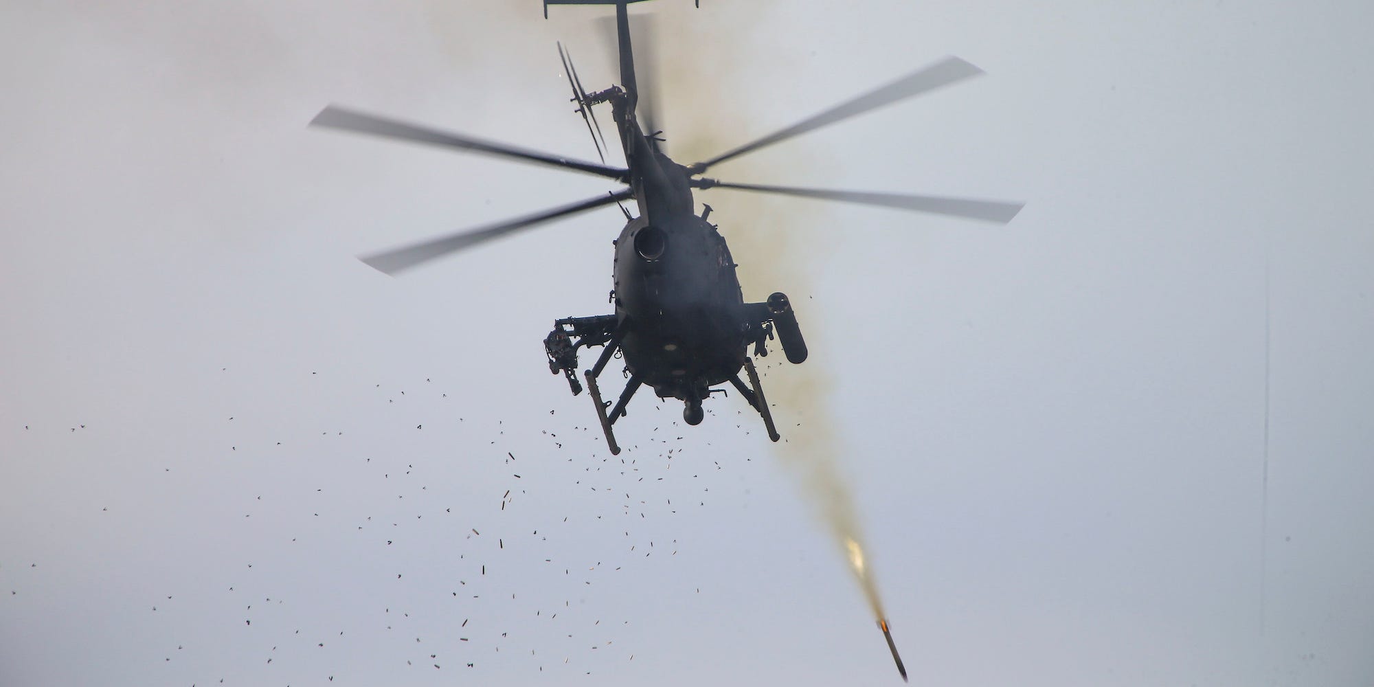 Army AH-6 Little Bird helicopter fires rockets