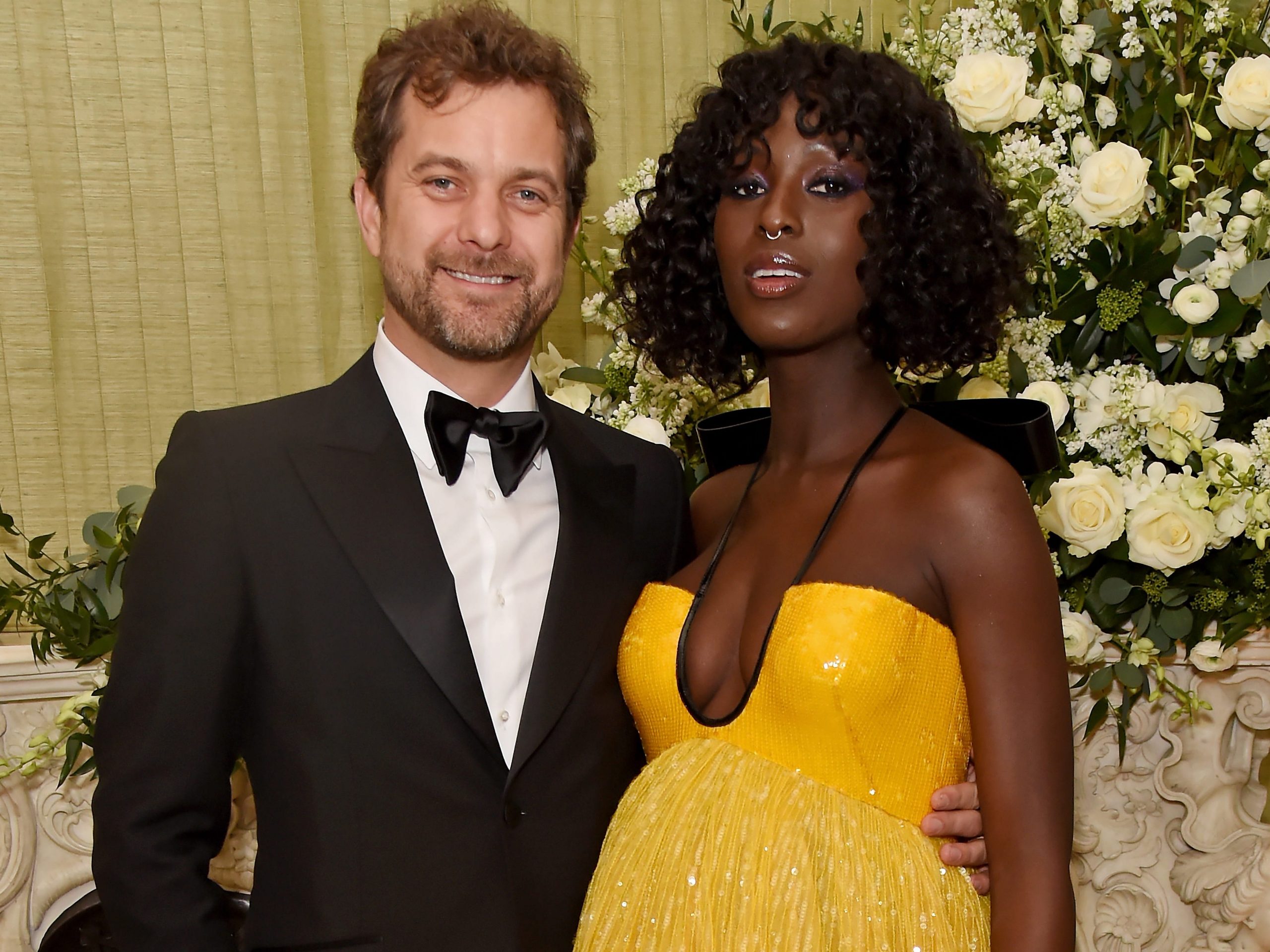 Joshua Jackson stands with his arm around his wife, Jodie Turner-Smith.