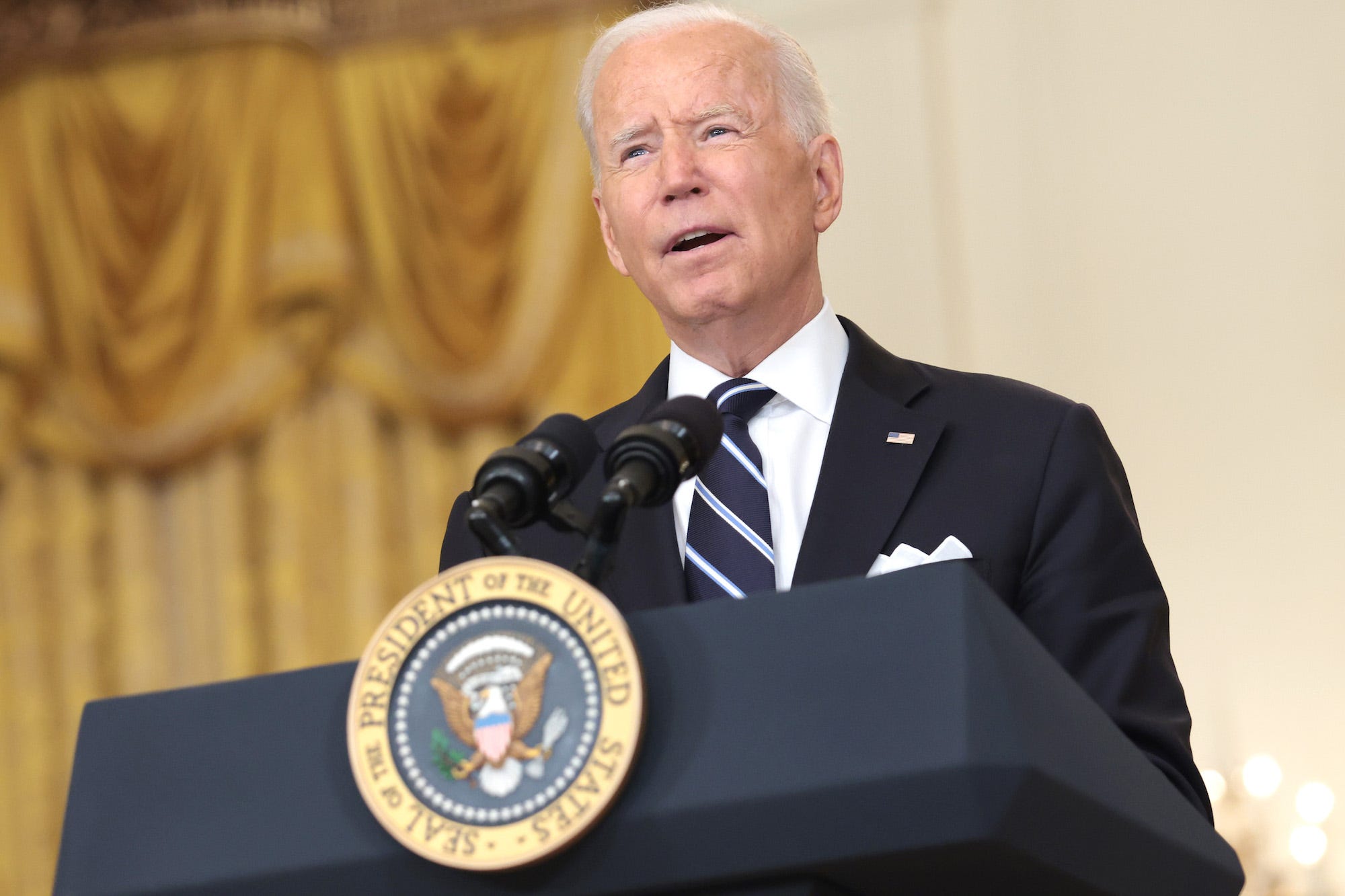 President Joe Biden speaking at a White House Podium in the White house