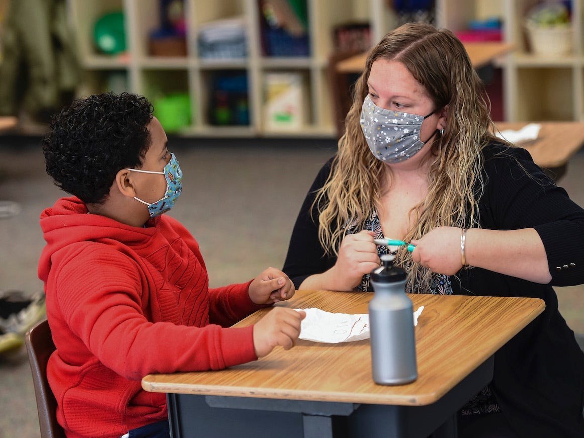 Learning Support teacher Sabrina Werley works with 4th grade student Jeremiah Ruiz at Cumru Elementary School in Cumru township Wednesday morning April 14, 2021.