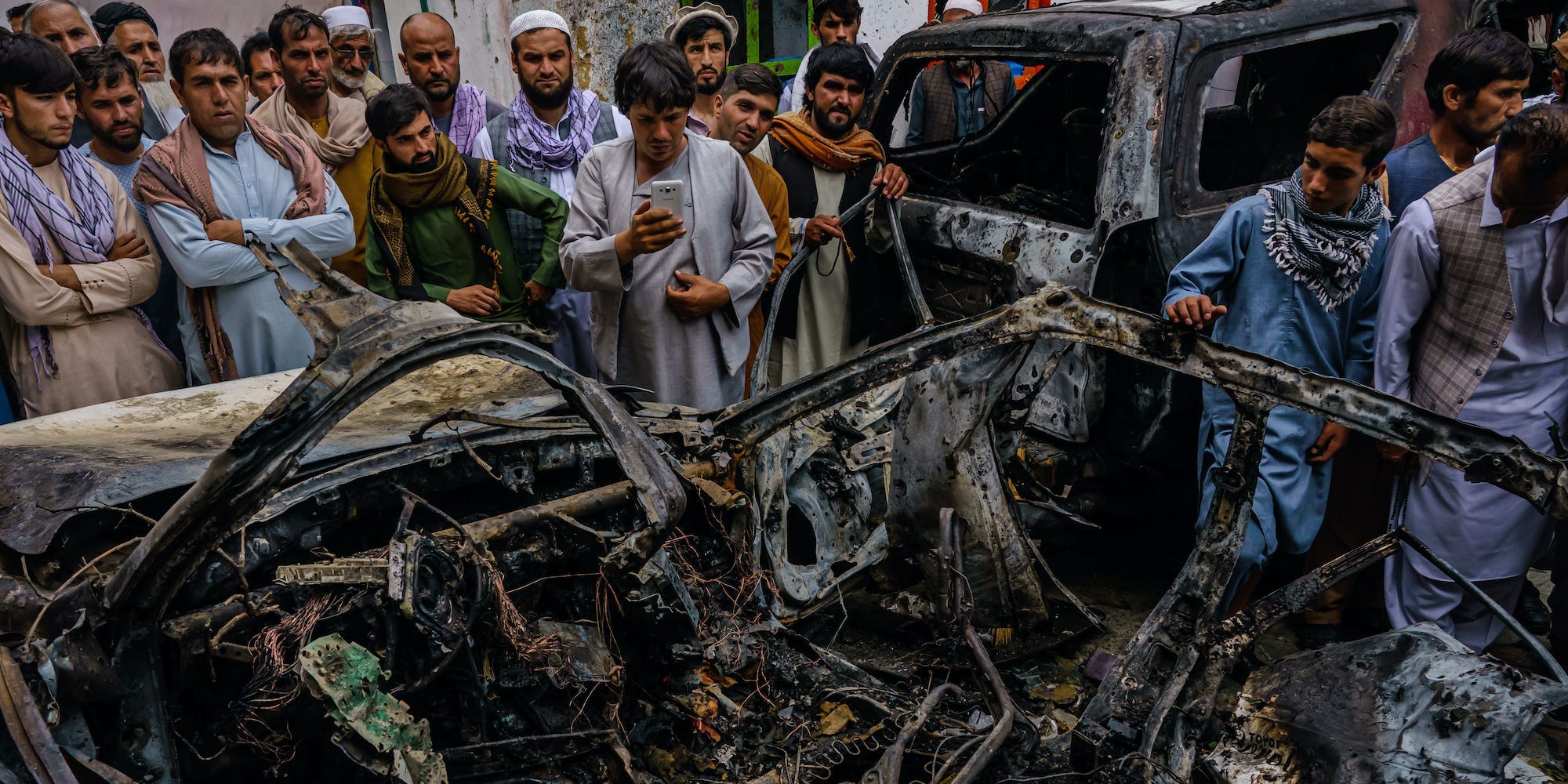 Afghans view aftermath of a US drone strike