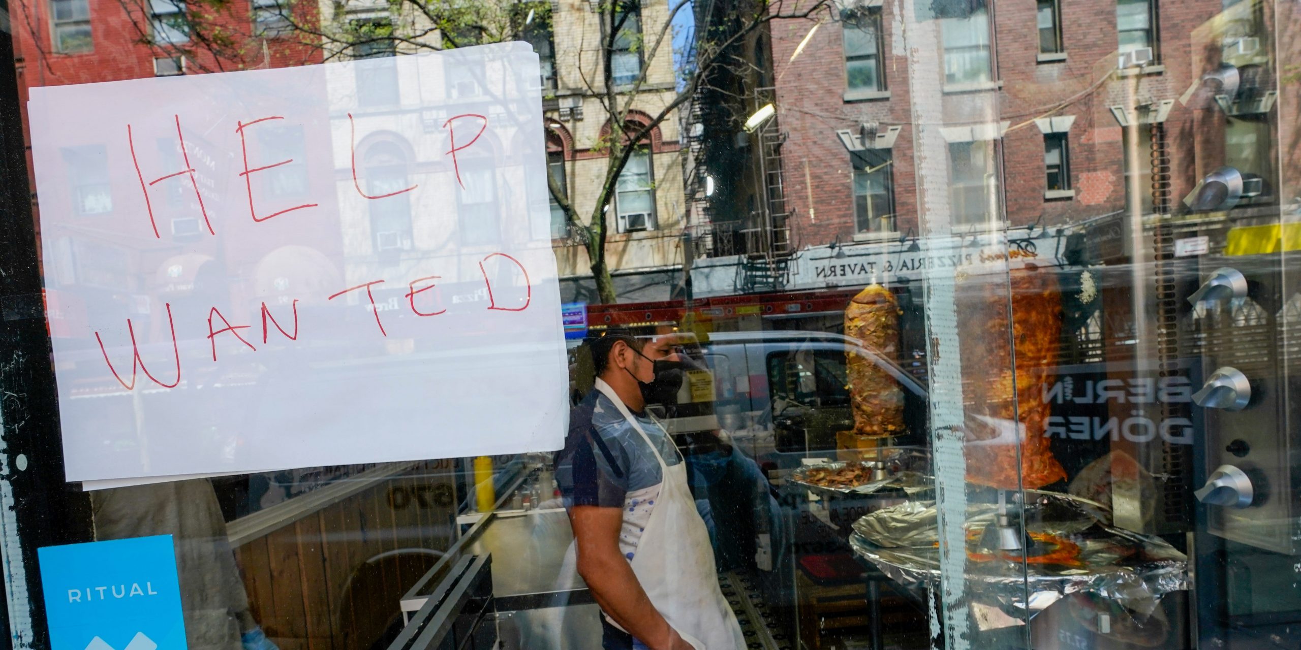 A help wanted sign in a New York City restaurant