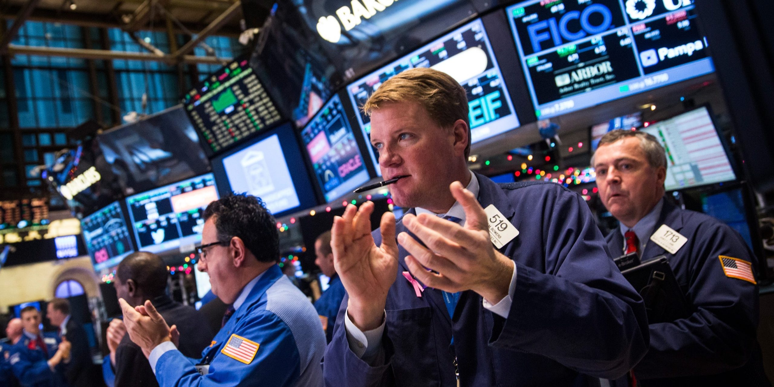 Traders work on the floor of the New York Stock Exchange during the afternoon of December 18, 2014 in New York City.