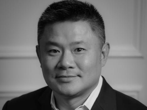 A headshot of Eric Huang, chief scientific officer of Moderna Genomics