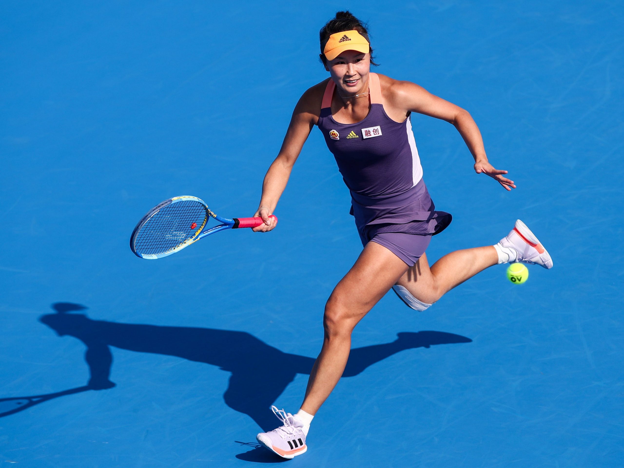 Shuai Peng of China returns a shot during the match against Ekaterina Alexandrova of Russia on Day 4 of 2020 WTA Shenzhen Open at Shenzhen Longgang Sports Center on January 8, 2020 in Shenzhen, China