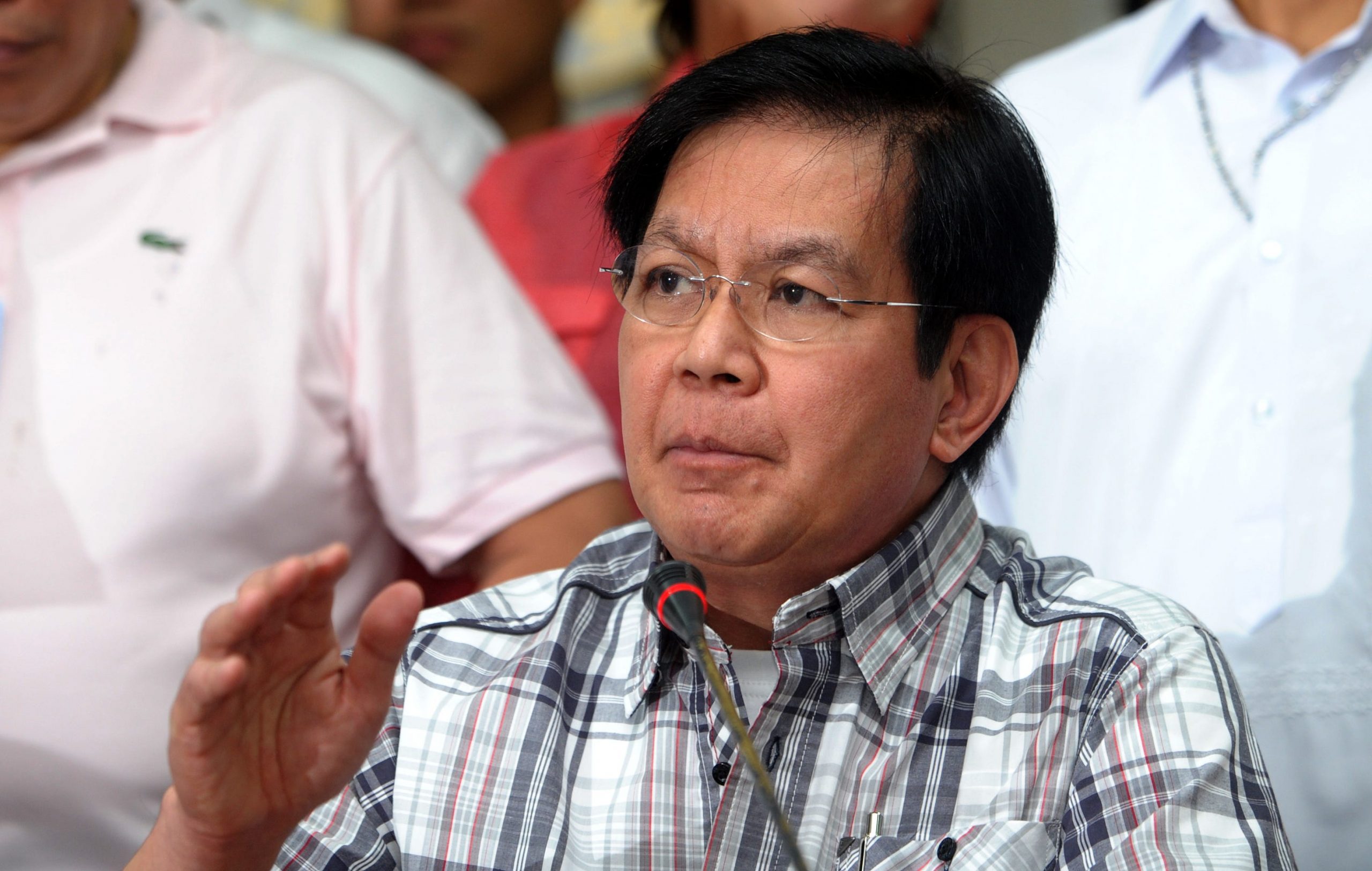 Panfilo Lacson gestures during a press conference in Manila