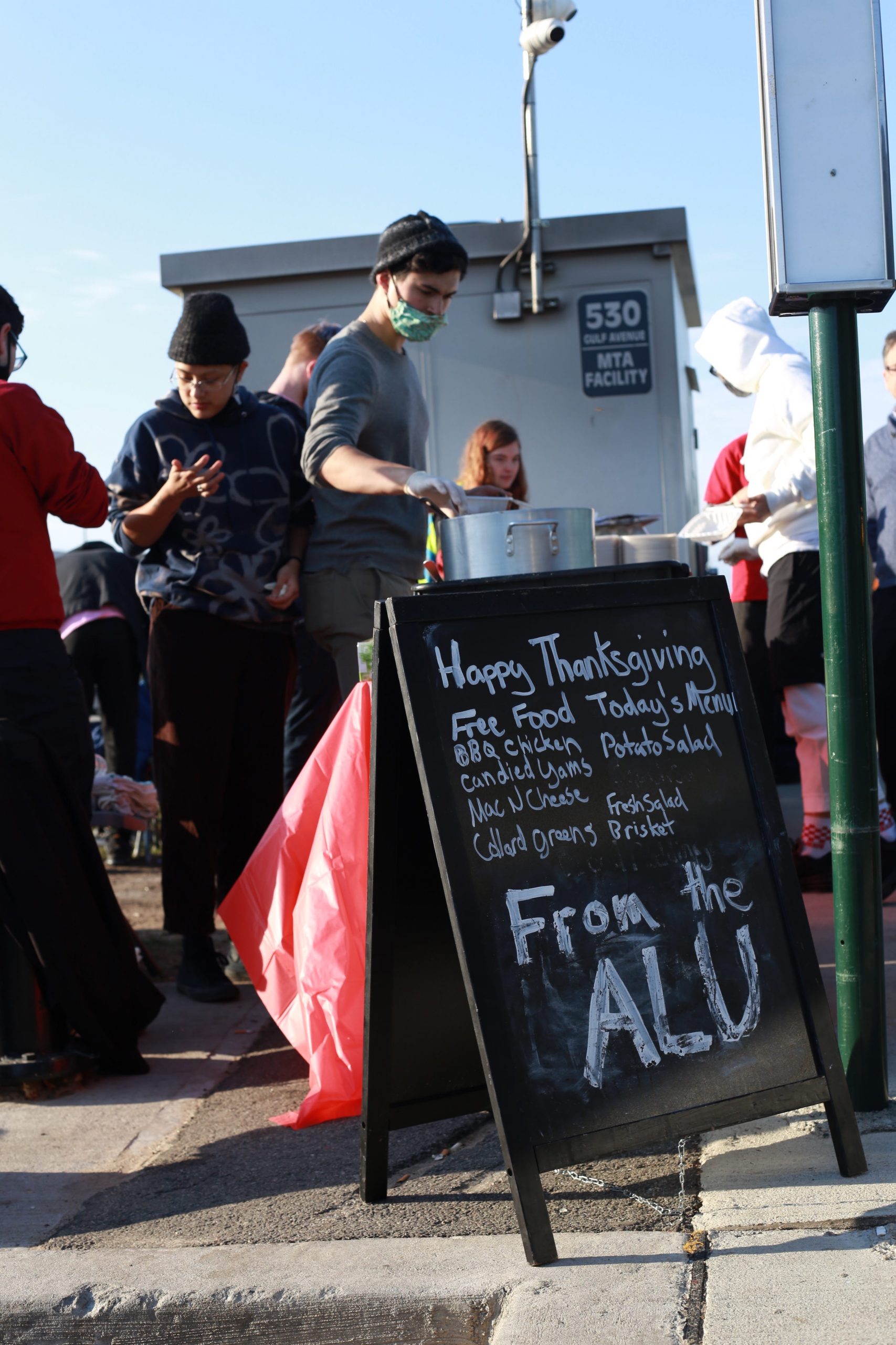 People attend a Thanksgiving event hosted by the Amazon Labor Union outside Amazon's JFK8 warehouse in Staten Island.