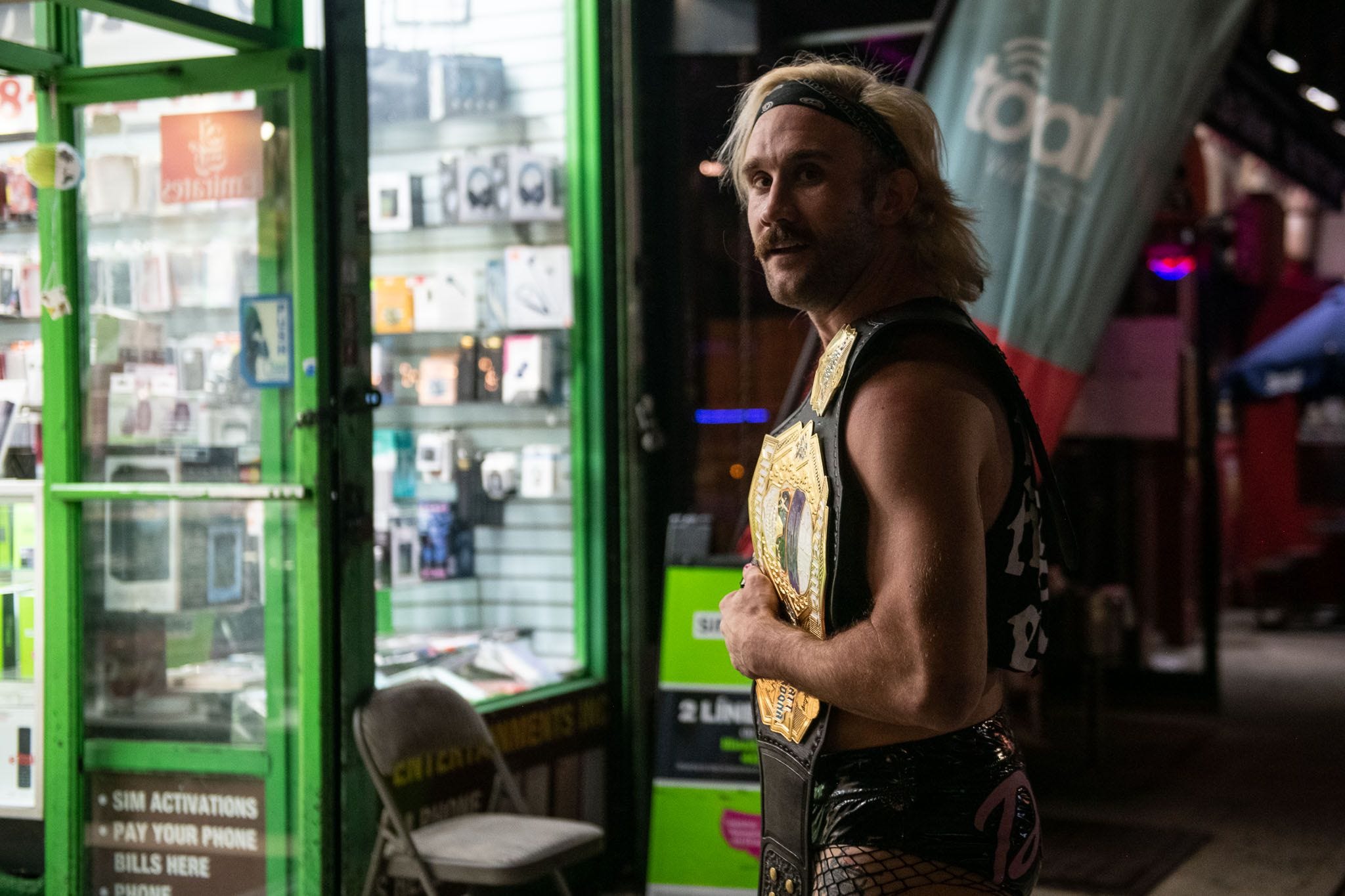 Independent wrestler Taylor Gibson, who goes by EFFY, holding a championship belt.