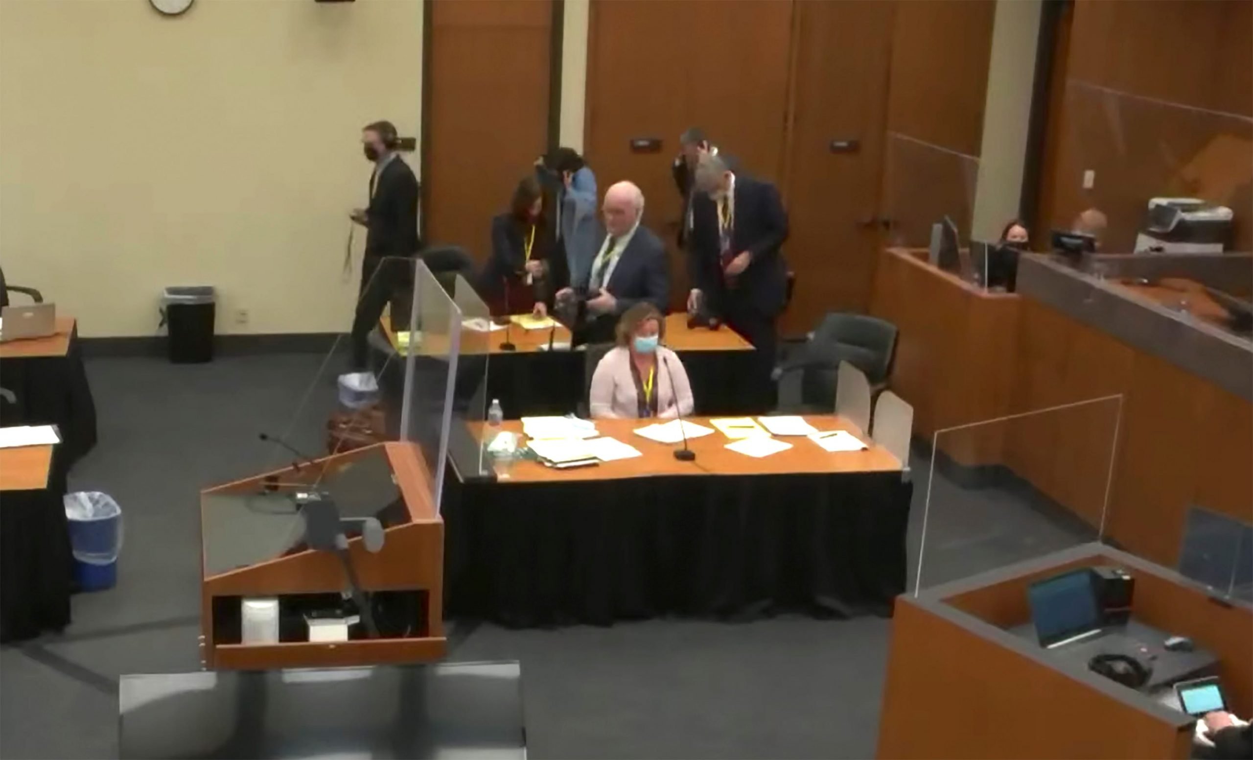 In this screen grab from video, former Brooklyn Center police Officer Kim Potter sits at the defense table, center, as Hennepin County Judge Regina Chu presides over jury selection Tuesday, Nov. 30, 2021, in the trial of Potter in the April 11, 2021, death of Daunte Wright, at the Hennepin County Courthouse in Minneapolis, Minn.