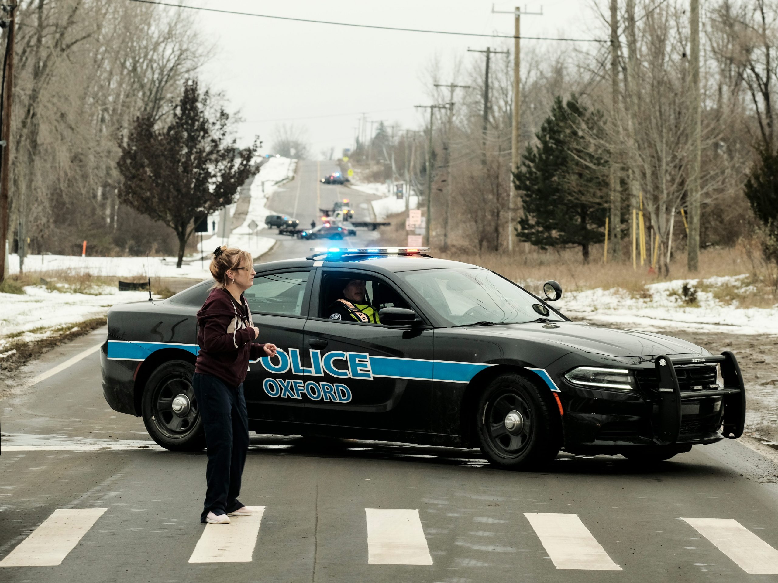 A police road block restricts access to Oxford High School following a shooting on November 30, 2021 in Oxford, Michigan.