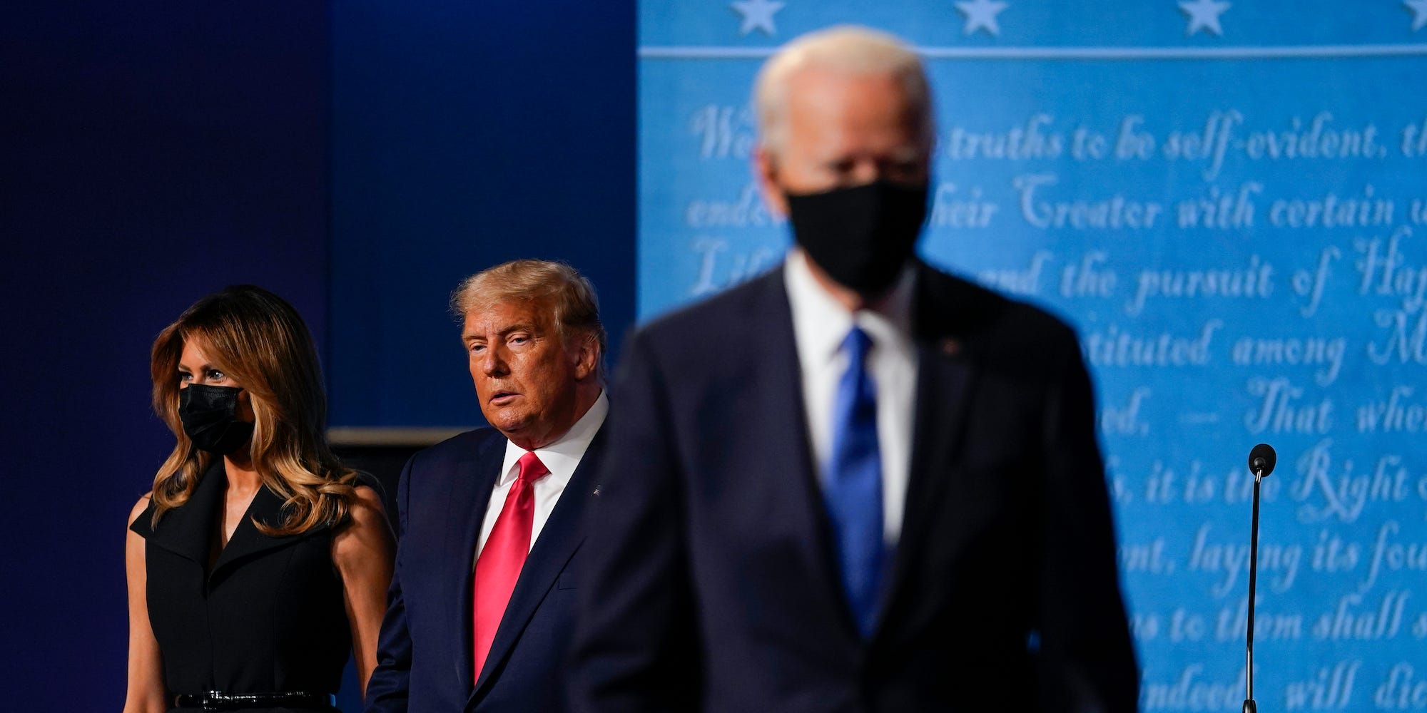 fFirst lady Melania Trump, left, and President Donald Trump, center, remain on stage as Democratic presidential candidate former Vice President Joe Biden, right, walk away at the conclusion of the second and final presidential debate Thursday, Oct. 22, 2020, at Belmont University in Nashville, Tenn.