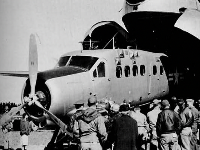 U-1 Otter emerges from the maw of a C-124.