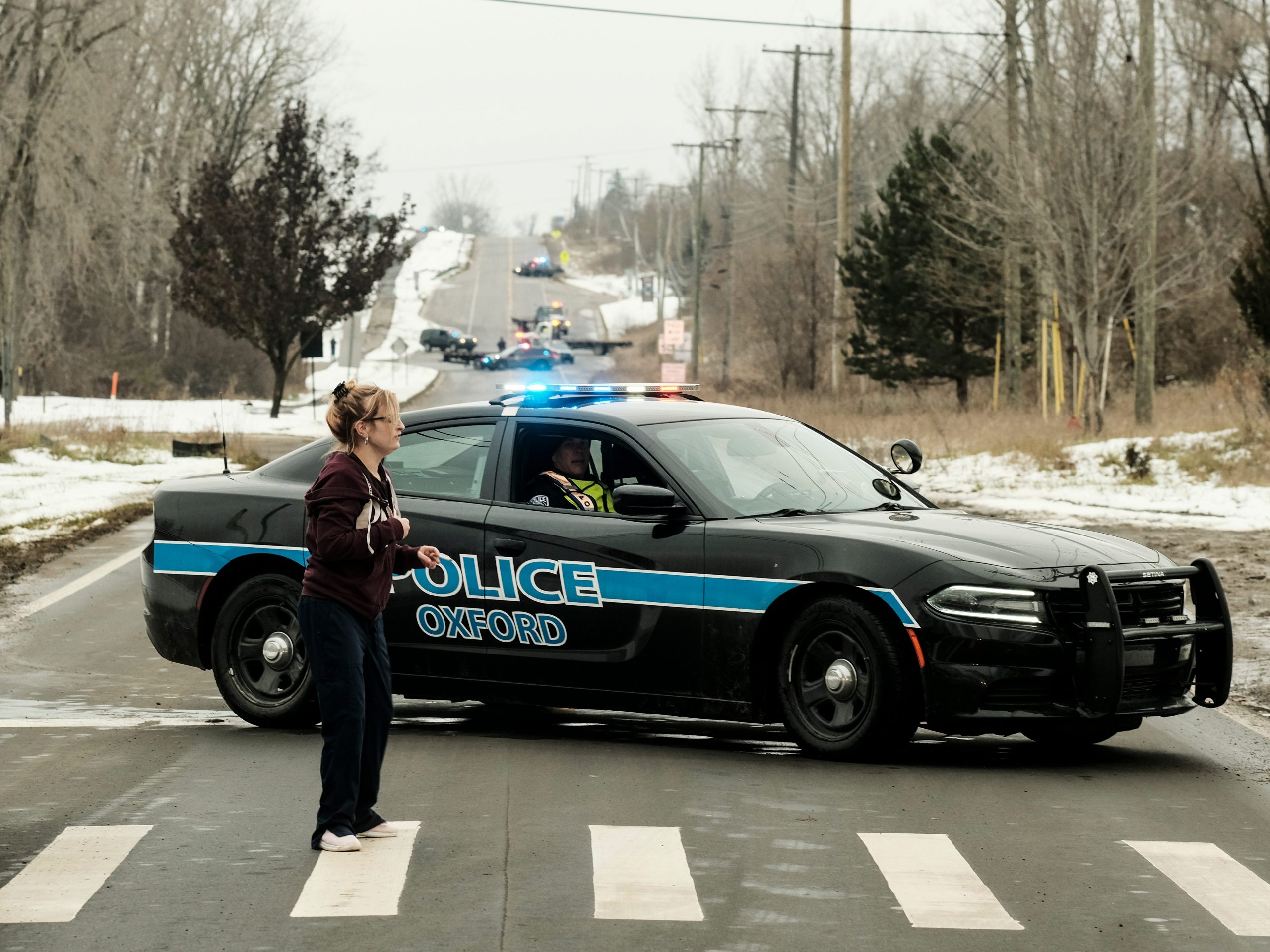 A police road block restricts access to Oxford High School following a shooting on November 30, 2021 in Oxford, Michigan.