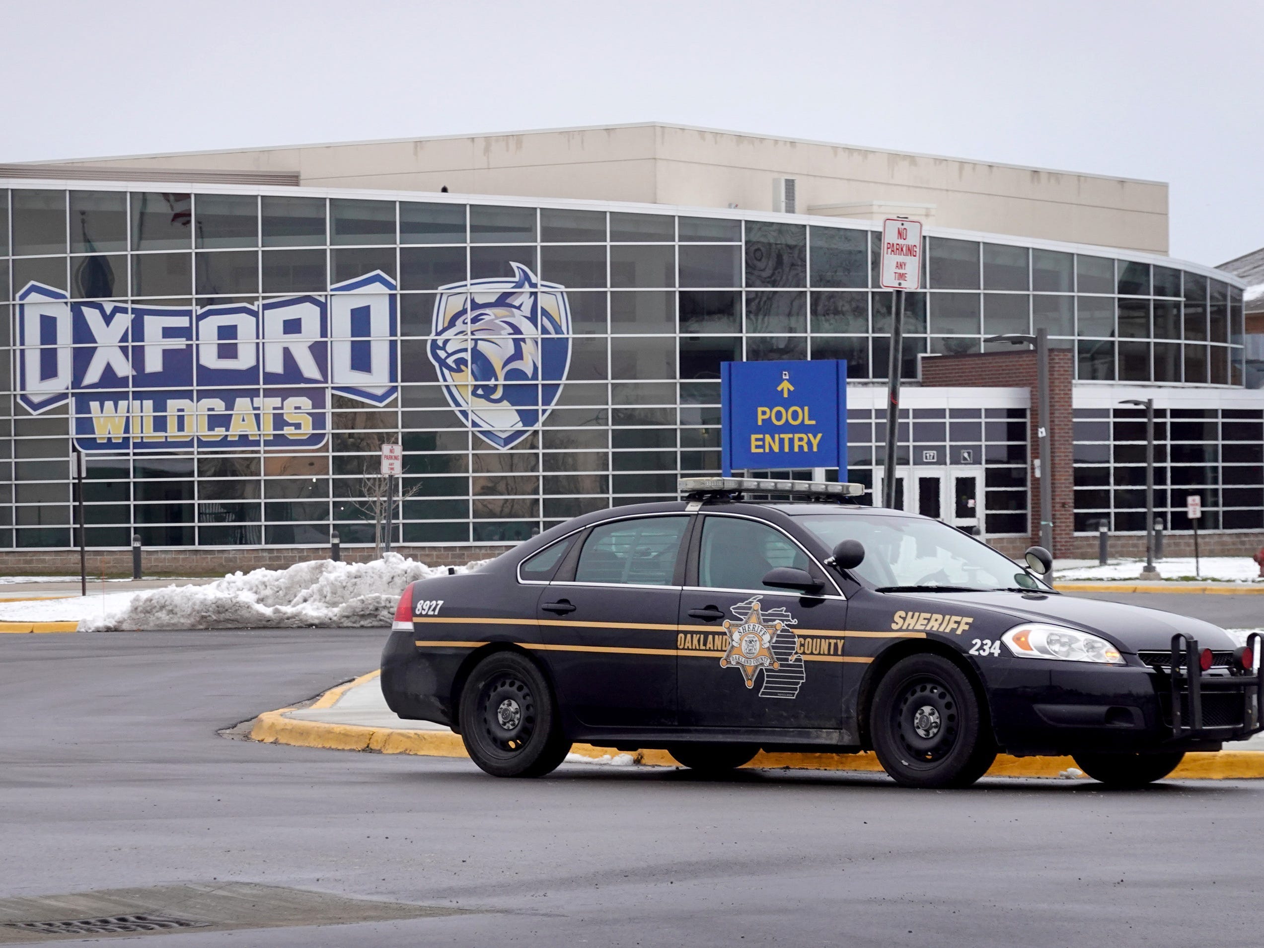 A police vehicle remains parked outside of Oxford High School on December 01, 2021 in Oxford, Michigan.