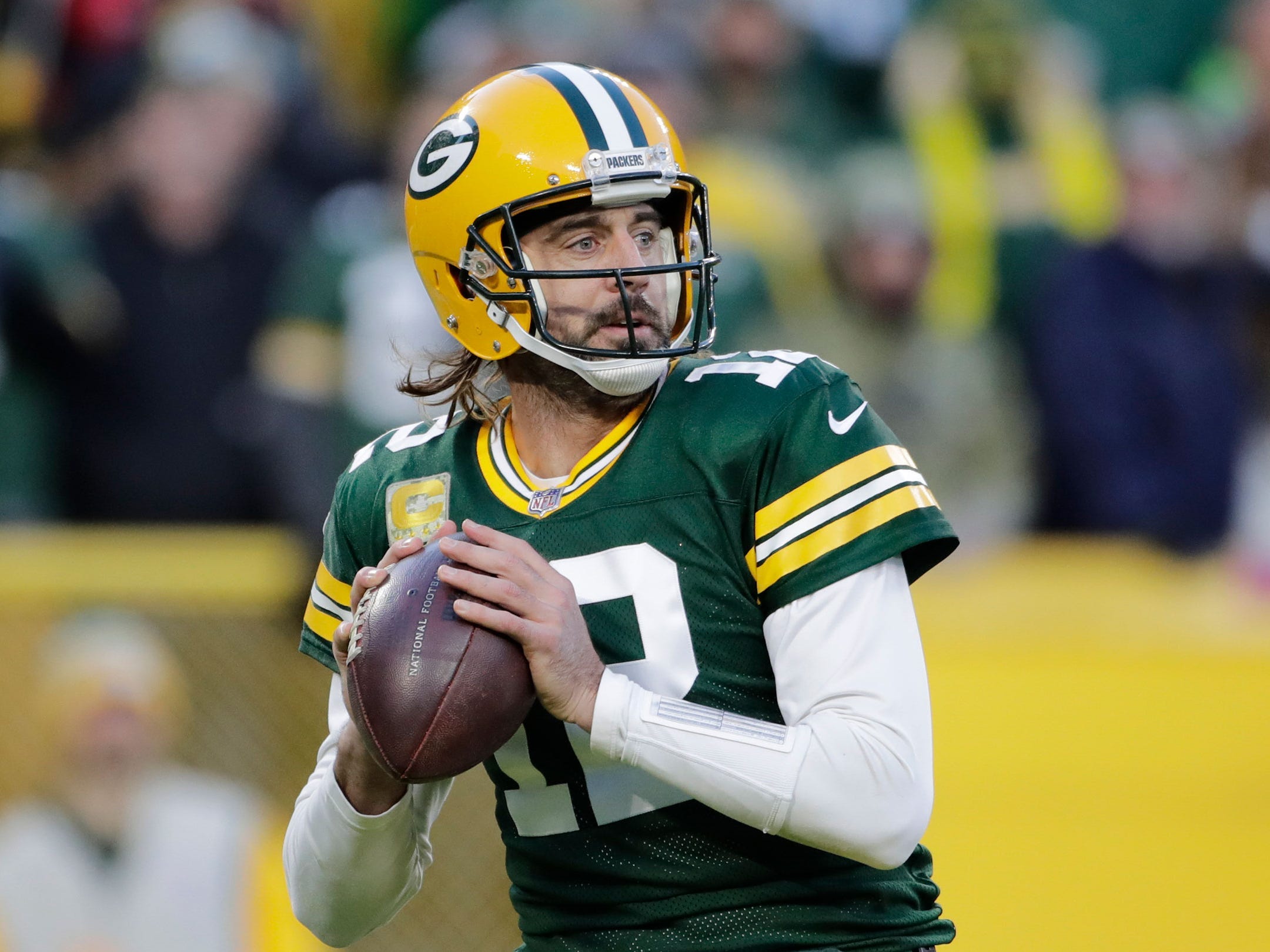 Aaron Rodgers looks to throw against the Seattle Seahawks.