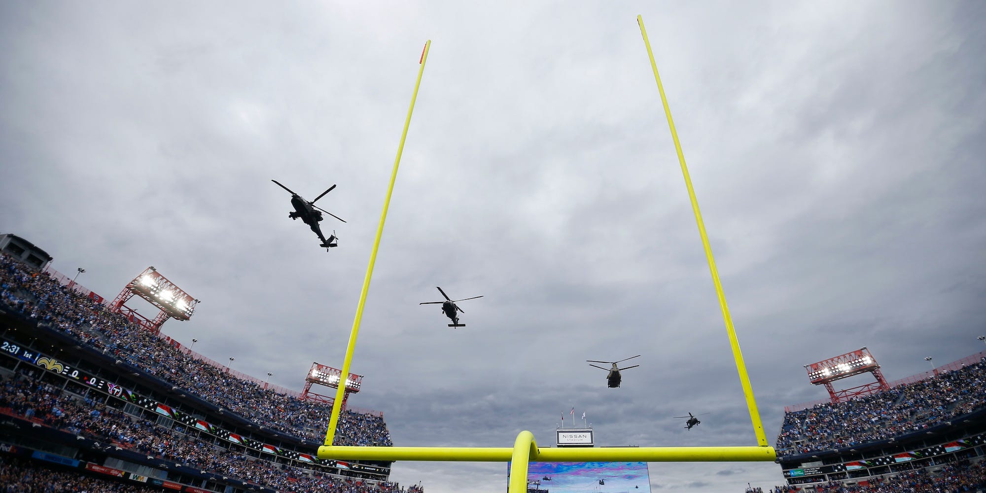 Military helicopters fly over Nissan Stadium before the Tennessee Titans face the New Orleans Saints at Nissan Stadium on November 14, 2021 in Nashville, Tennessee.