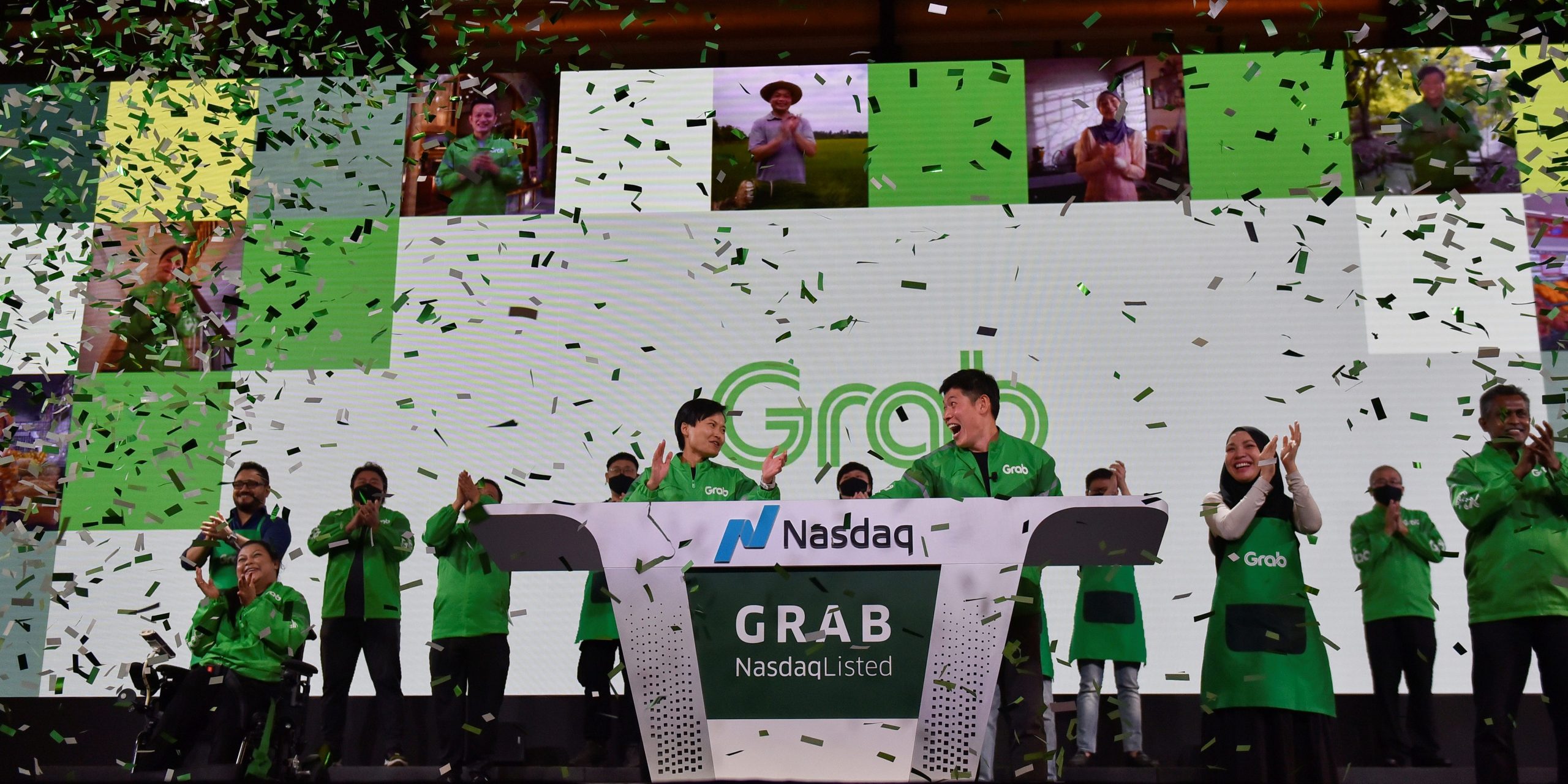 Grab's CEO Anthony Tan and co-founder Tan Hooi Ling celebrate as they attend the Grab Bell Ringing Ceremony at a hotel in Singapore, December 2, 2021.