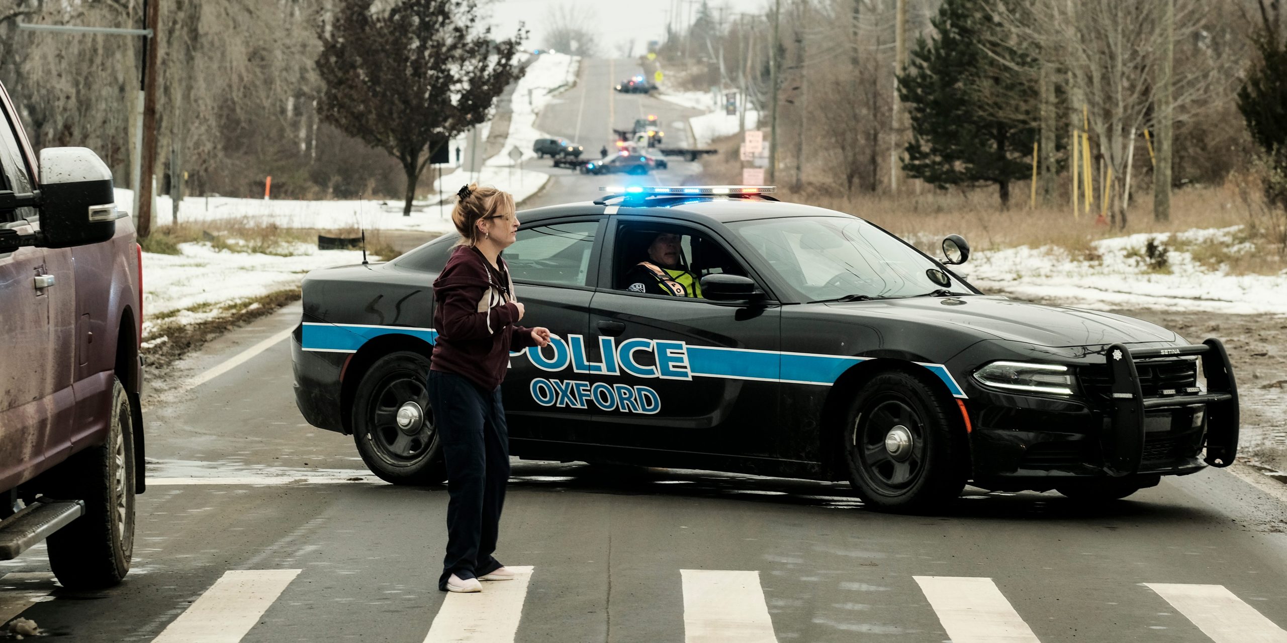 A police road block restricts access to Oxford High School following a shooting on November 30, 2021 in Oxford, Michigan.