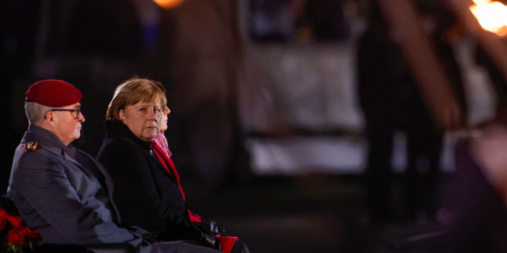 German Chancellor Angela Merkel follows proceedings at the Defence Ministry during the Grand Tattoo (Grosser Zapfenstreich), a ceremonial send-off for her in Berlin on December 2, 2021. (Photo by Odd ANDERSEN / POOL / AFP) (Photo by ODD ANDERSEN/POOL/AFP via Getty Images)