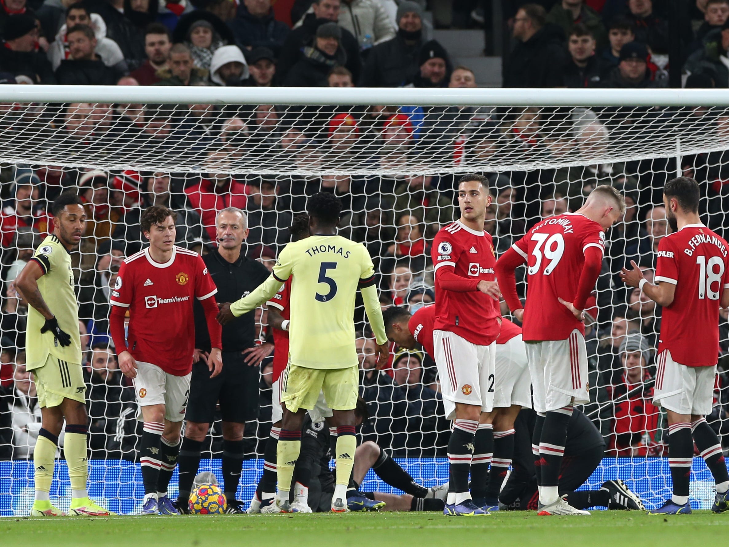 David de Gea of Manchester United is treated prior to the opening goal during the Premier League match between Manchester United and Arsenal