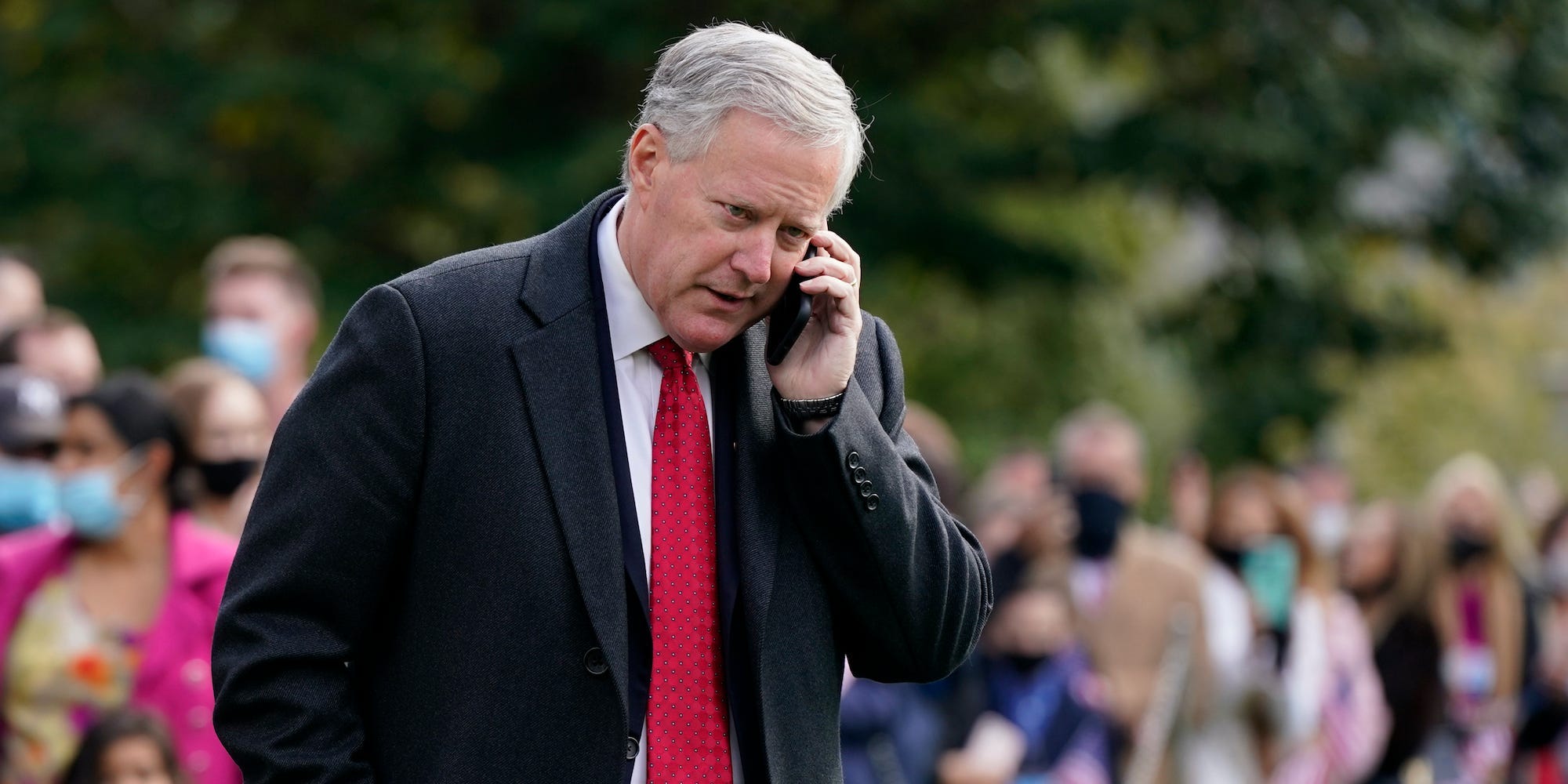 White House chief of staff Mark Meadows speaks on a phone on the South Lawn of the White House in Washington, on Oct. 30, 2020