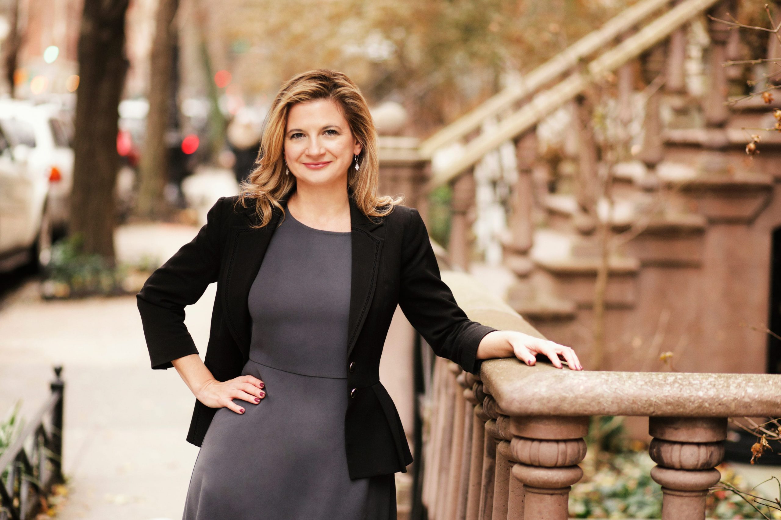 Kristen Ankerbrandt, CFO Compass stands on a residential street