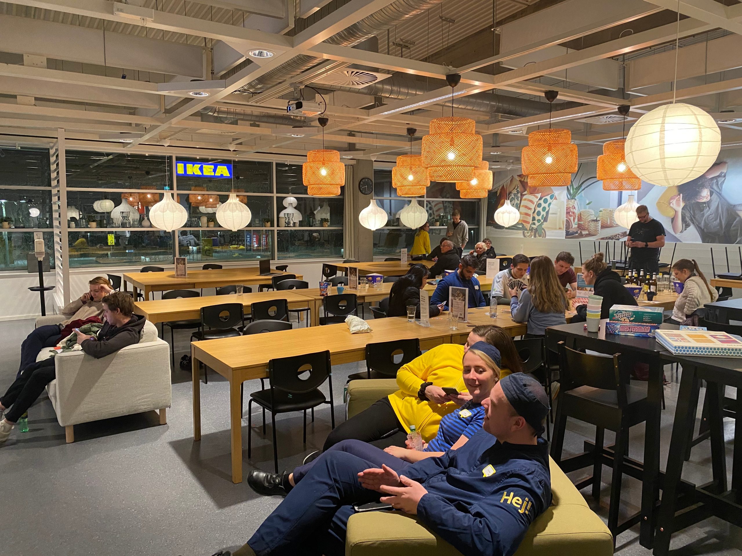 Trapped by a snowstorm, customers and IKEA staff hang out in the staff cafeteria.