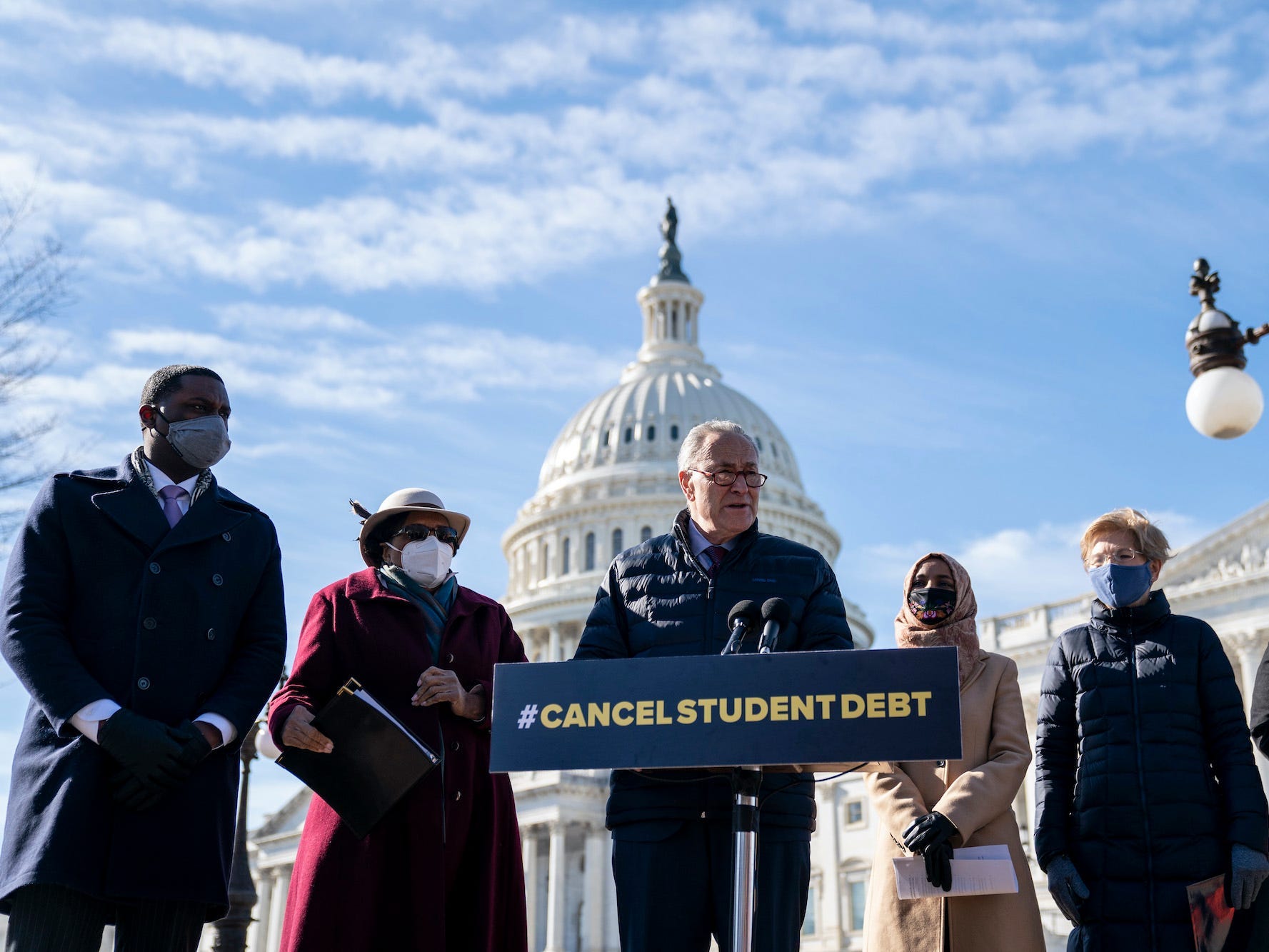 WASHINGTON, DC - FEBRUARY 4: Senate Majority Leader Chuck Schumer (D-NY) speaks during a press conference about student debt outside the U.S. Capitol on February 4, 2021 in Washington, DC. Also pictured, L-R, Rep. Mondaire Jones (D-NY), Rep. Alma Adams (D-NC), Rep. Ilhan Omar (D-MN), Sen. Elizabeth Warren (D-MA) and Rep. Ayanna Pressley (D-MA). The group of Democrats re-introduced their resolution calling on President Joe Biden to take executive action to cancel up to $50,000 in debt for federal student loan borrowers.