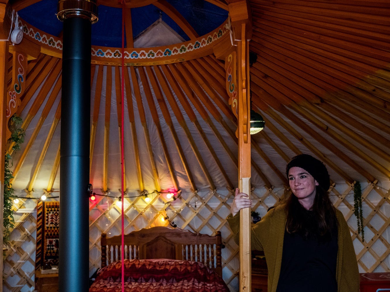 Chris Heijmans stands in her yurt.