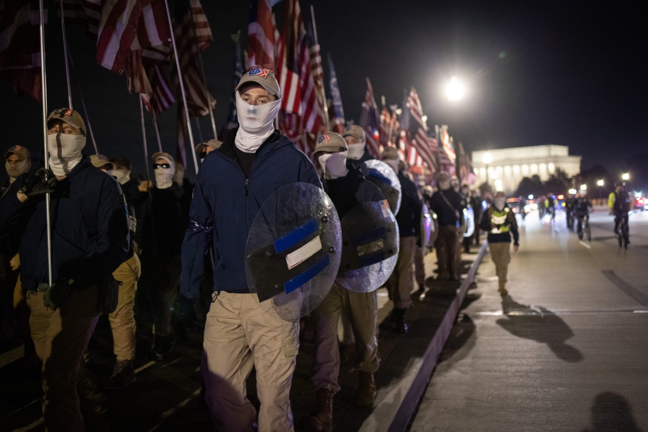 Members of the right-wing group Patriot Front march across Memorial Bridge in front of the Lincoln Memorial on December 04, 2021 in Washington, DC.
