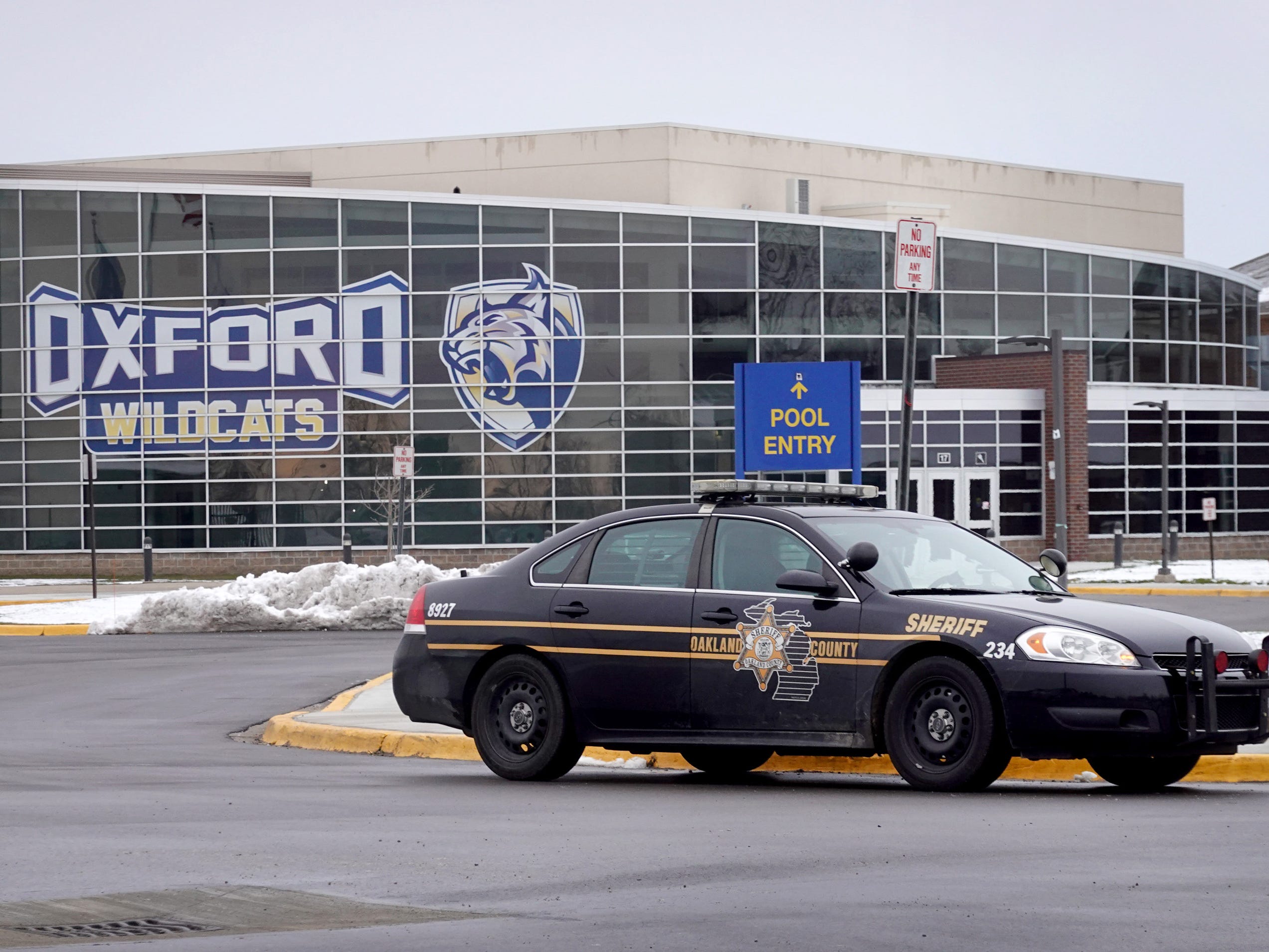 A police vehicle remains parked outside of Oxford High School on December 01, 2021 in Oxford, Michigan.