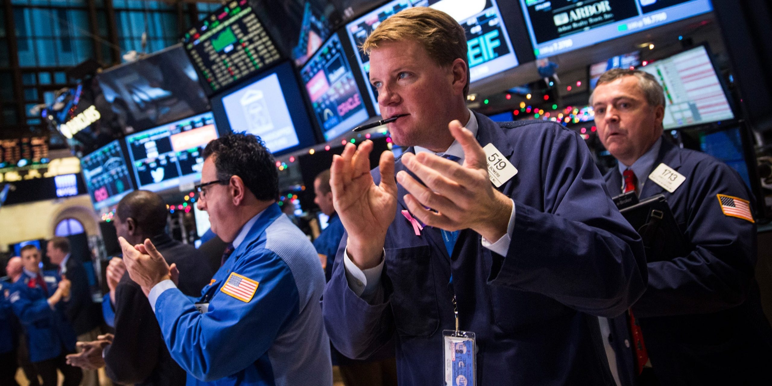 Traders work on the floor of the New York Stock Exchange during the afternoon of December 18, 2014 in New York City.