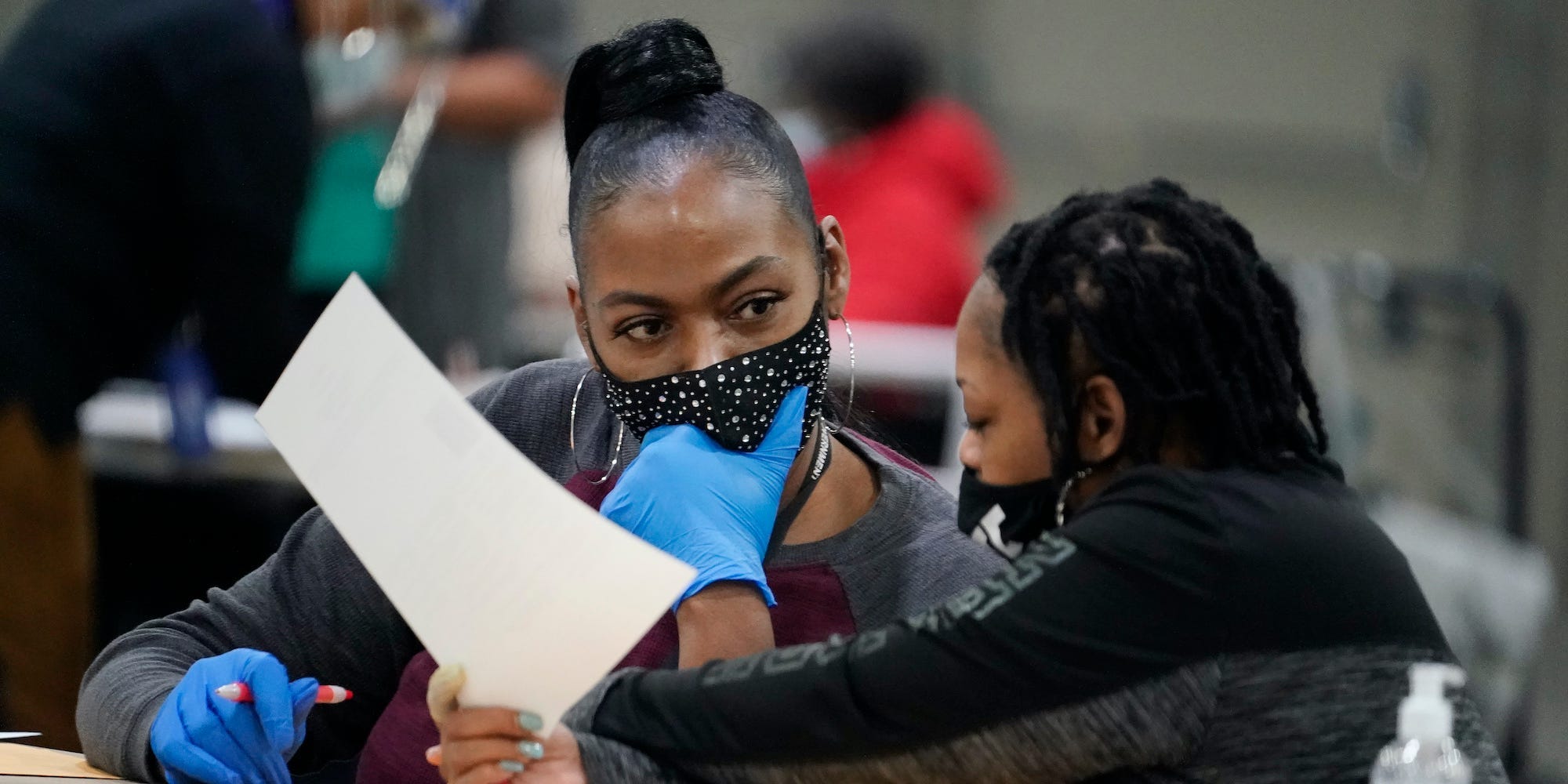 Officials sort ballots during an audit at the Georgia World Congress Center on Saturday, Nov. 14, 2020, in Atlanta.