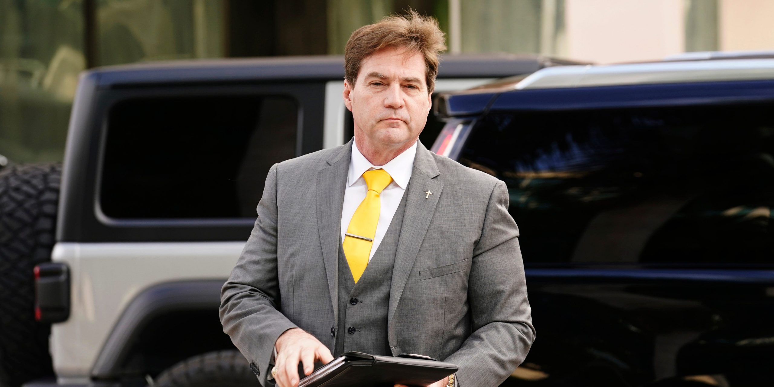 Craig Wright walking into a federal courthouse in Miami.