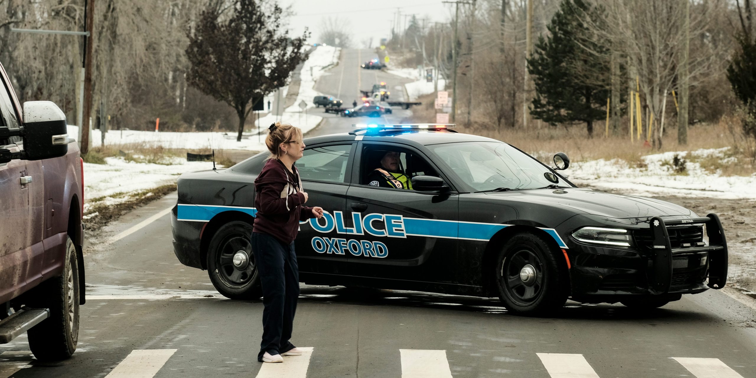 A police road block restricts access to Oxford High School following a shooting on November 30, 2021 in Oxford, Michigan.