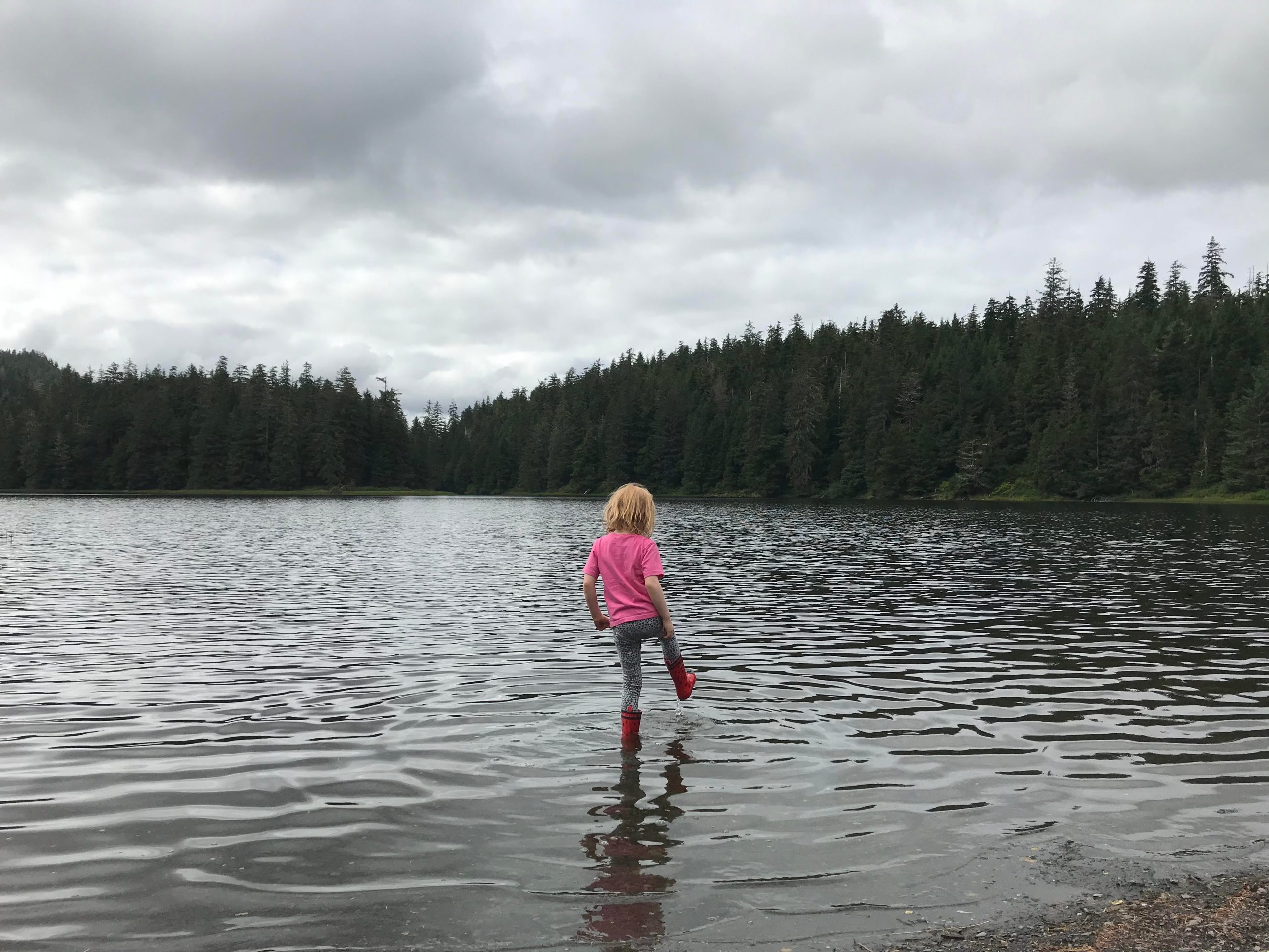 Girl playing in the water in Alaska