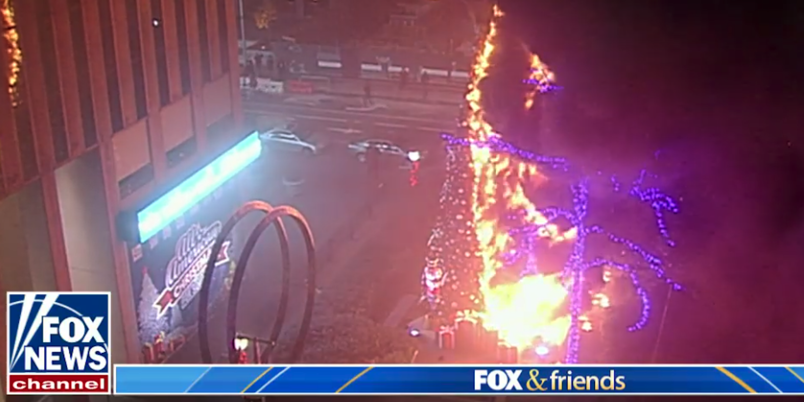 A security camera shows the Fox News Christmas tree on fire.