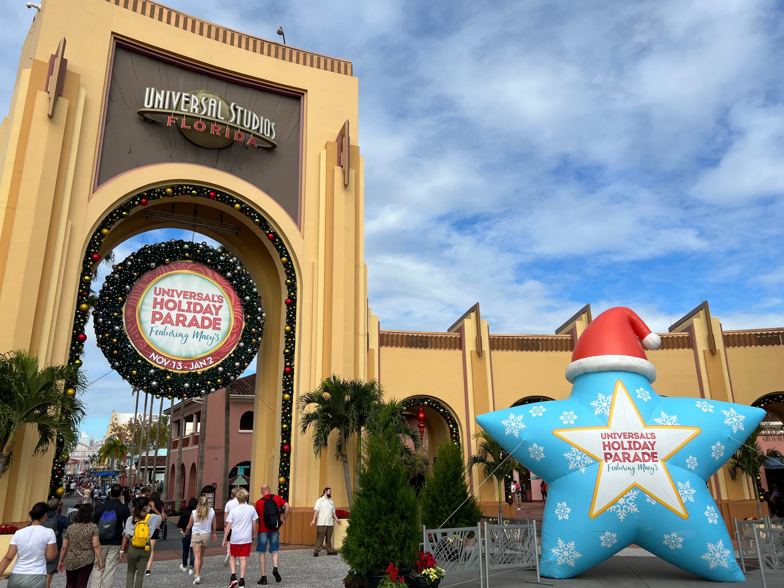 Some of Universal Orlando's holiday decorations, including an inflatable blue star with a Santa hat.