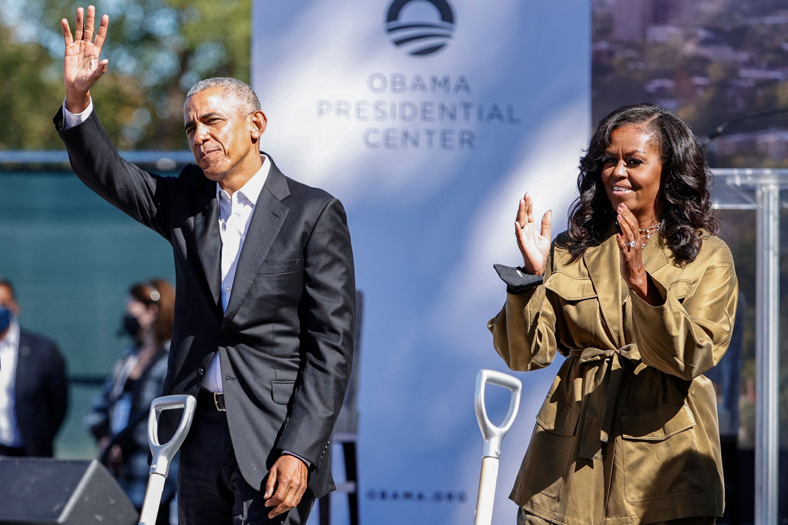 President Barack Obama and First Lady Michelle waving at supporters