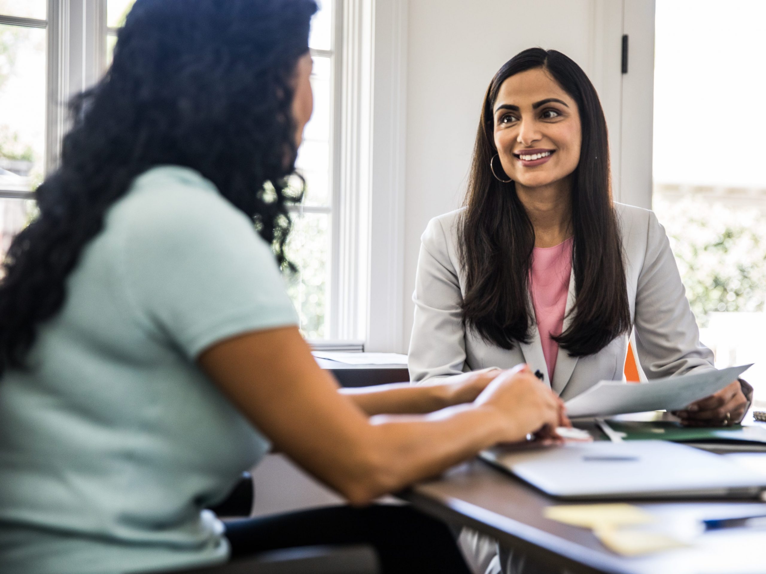 Two women in a business meeting.