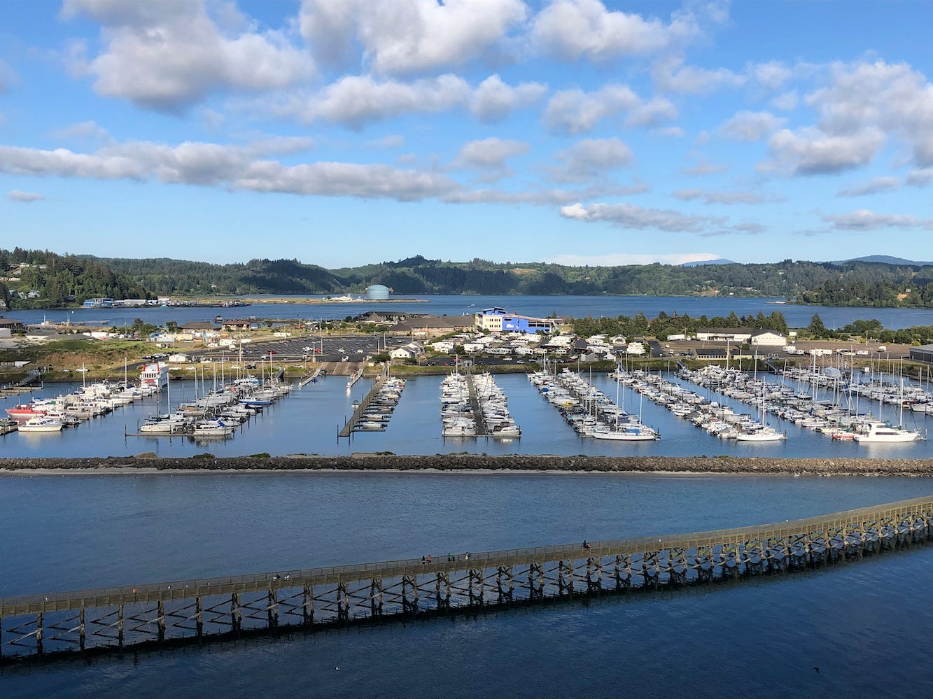 Oregon State University's Marine Studies Building, which is under construction in a tsunami inundation zone, is viewed from the Yaquina Bay Bridge in Newport, Ore. The building, center right, is surrounded by Yaquina Bay. The Oregon Legislature appears poised to continue to allow construction of critical facilities in tsunami inundation zones, a move slammed by critics, July 22, 2019.