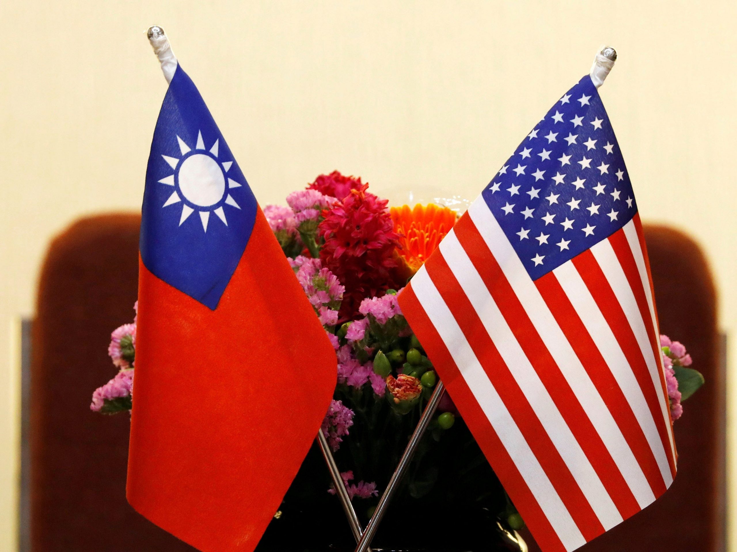 Flags of Taiwan and the United States are seen placed on a table.