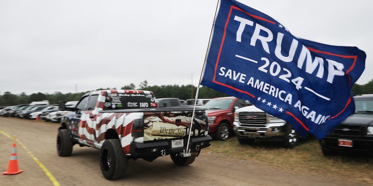 A truck with a 'Trump 2024' flag arrives at a "Save America" rally with former President Donald Trump at York Family Farms on August 21, 2021 in Cullman, Alabama.