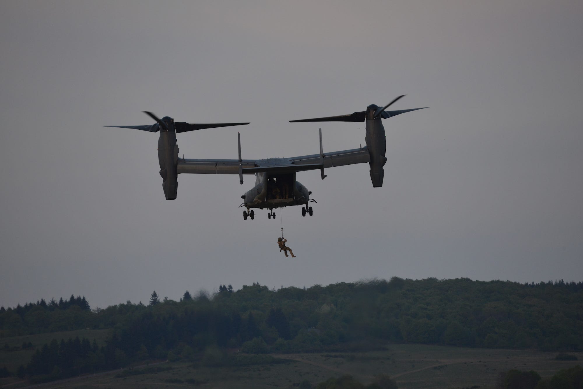 Special Forces soldiers fast-roping from CV-22 Osprey