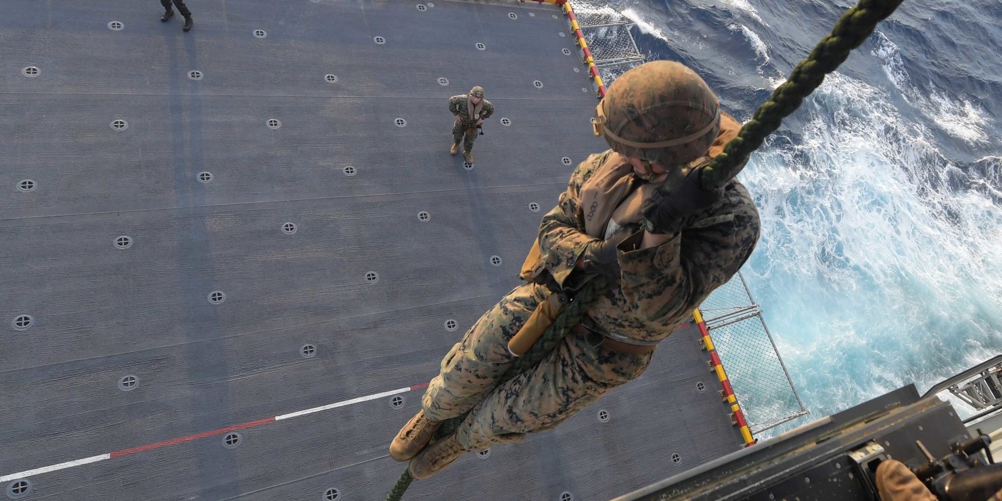 Marines perform a fast-rope exercise