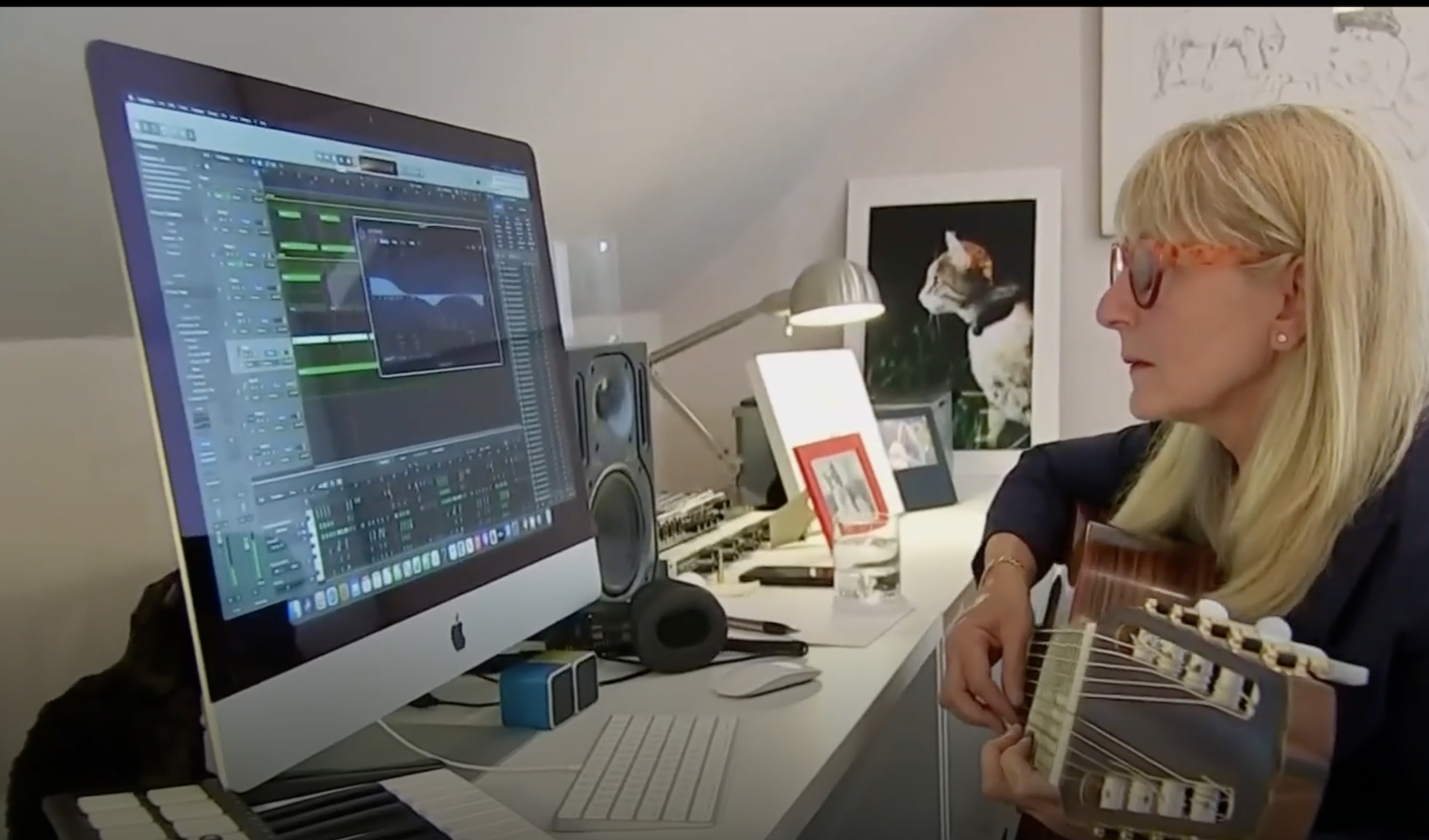 Janet Marlow making a music track on her computer.