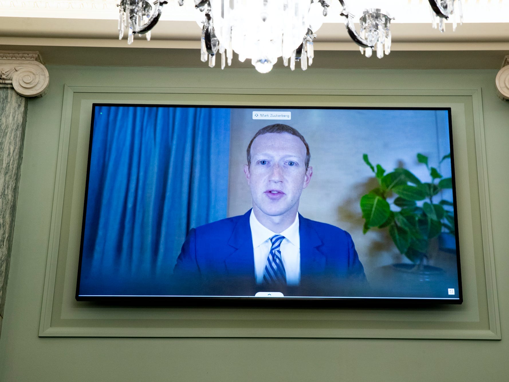Facebook CEO Mark Zuckerberg appears on a screen as he speaks remotely during a hearing before the Senate Commerce Committee on Capitol Hill, Wednesday, Oct. 28, 2020, in Washington. The committee summoned the CEOs of Twitter, Facebook and Google to testify.